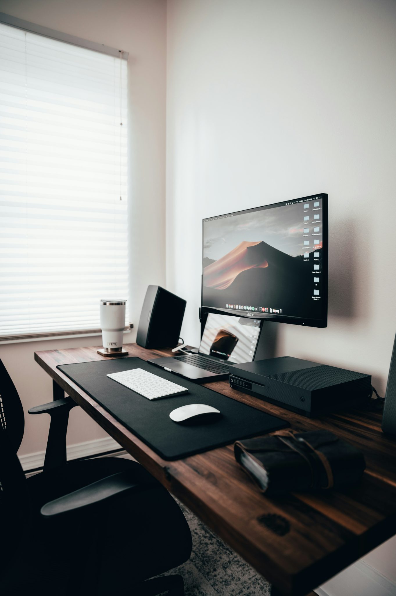 Now this desk setup is something I am super proud of... My cousin made the tabletop out of solid black walnut. I added in some adjustable legs from IKEA and got the other desk stuff on Amazon. If you