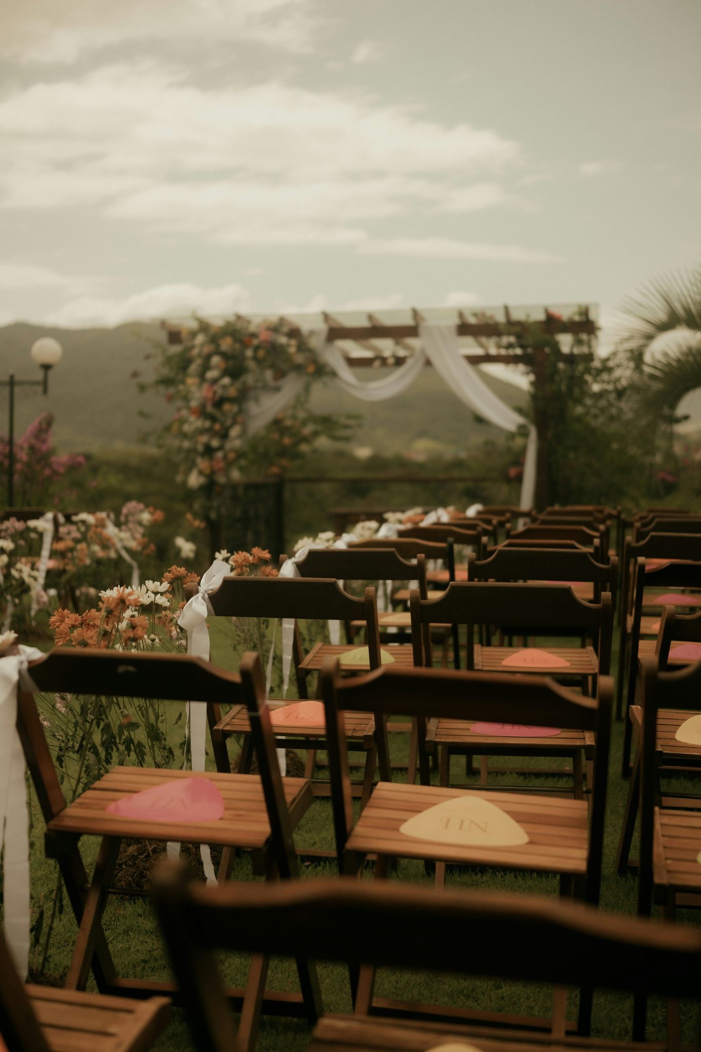 Outdoor wedding ceremony seating with floral decorations
