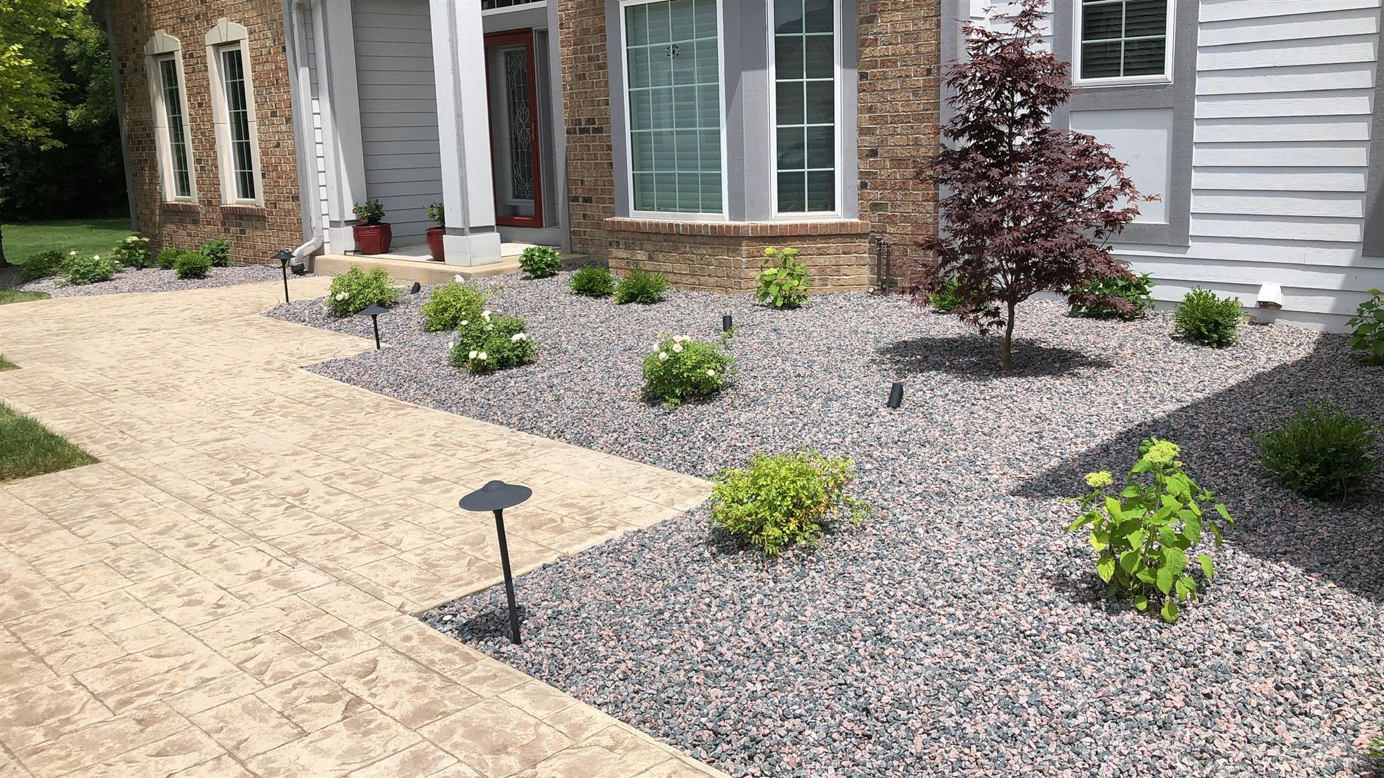 Paver stone walkway with gravel landscaping | Palladium Patios & Landscaping LLC Mequon, Wisconsin 53092