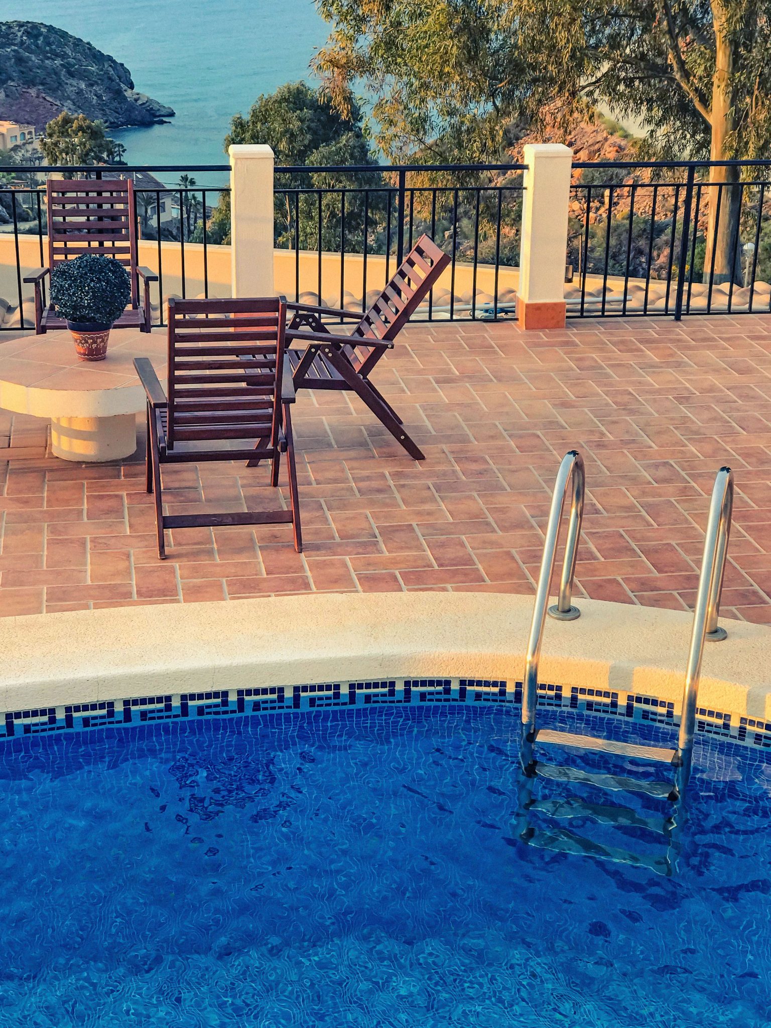 Relaxing outdoor terrace with pool and ocean view - perfect for vacations.