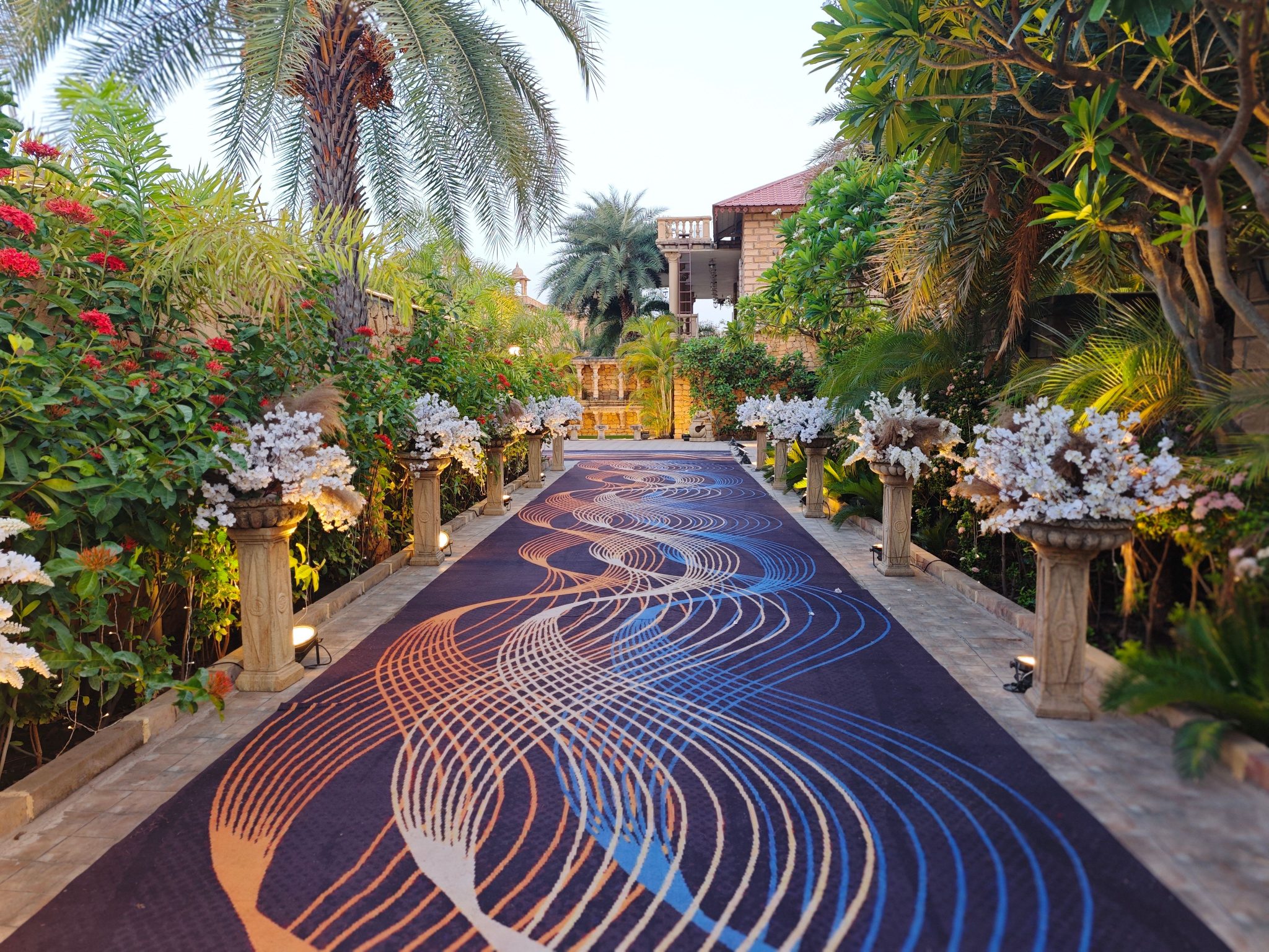 Stunning garden pathway with elegant floral decoration and intricate design carpet.