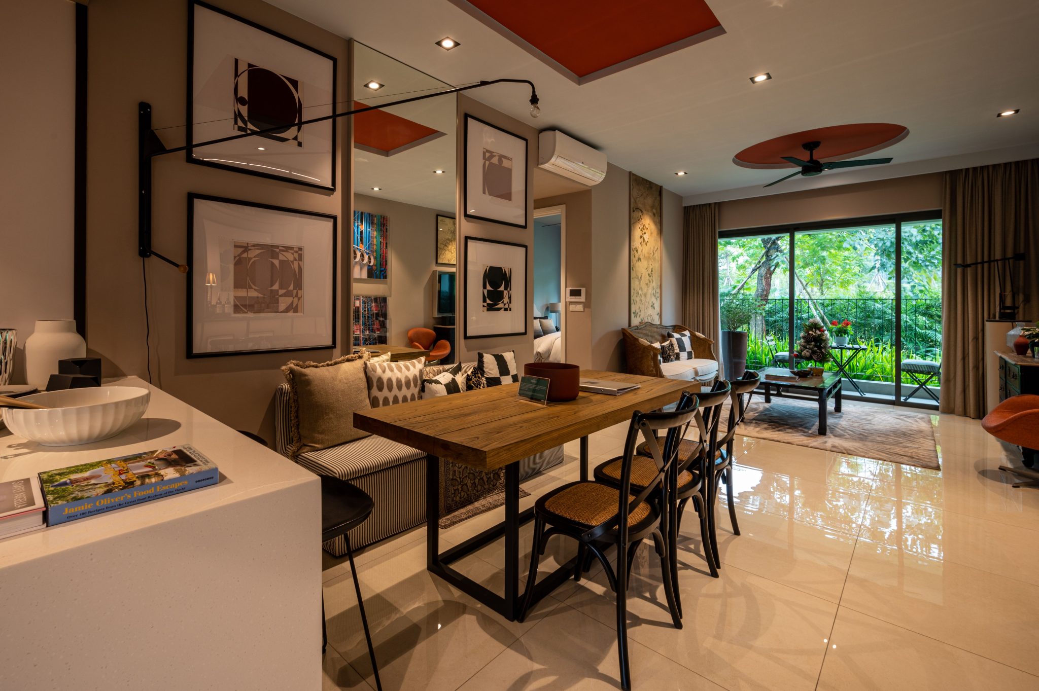 Stylish open dining area with wooden table and modern decor in bright living room.