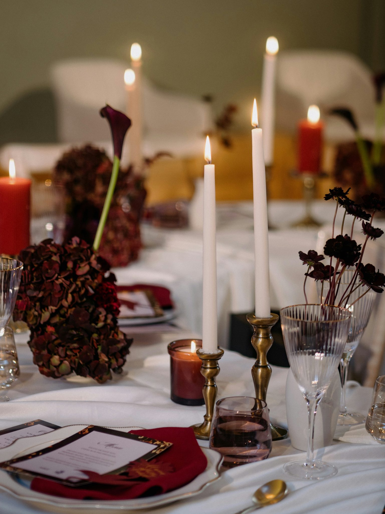 A beautifully set table with candles and flowers