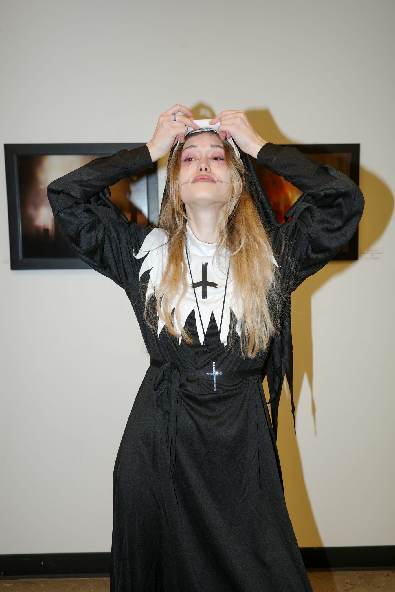 A candid black-and-white moment from a Ukrainian Halloween party. Costumes, makeup, and expressive gestures capture creativity, community, and cultural identity in a festive nighttime setting. The mon