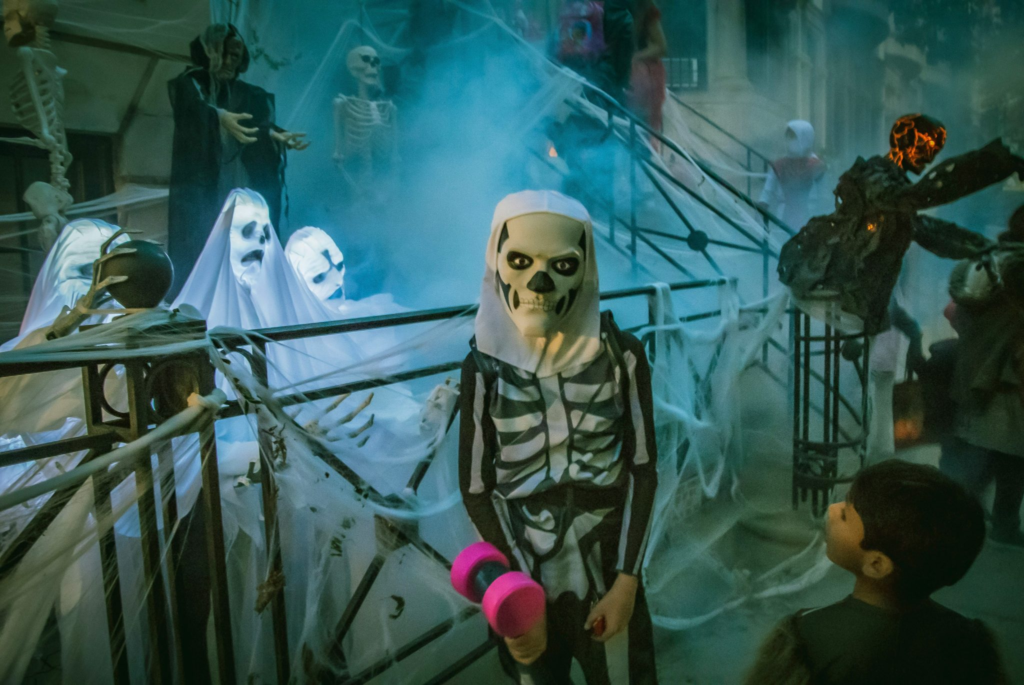 A scary looking kid dresses up as a skeleton for Halloween in New York.