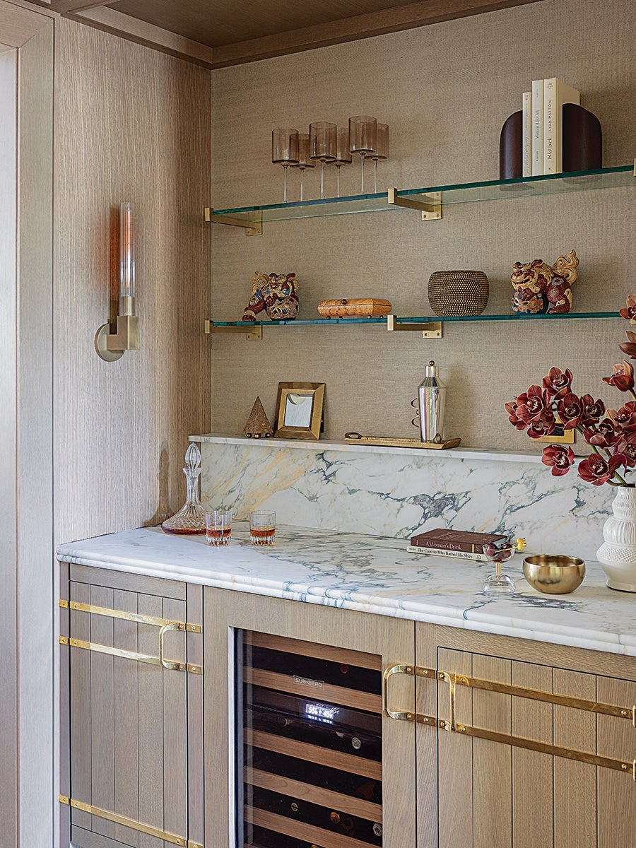 A Wall of Burgundy Kitchen Cabinets Creates Moody Elegance