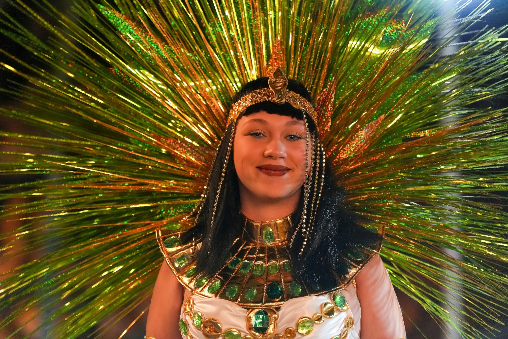 A woman poses in an elaborate headdress