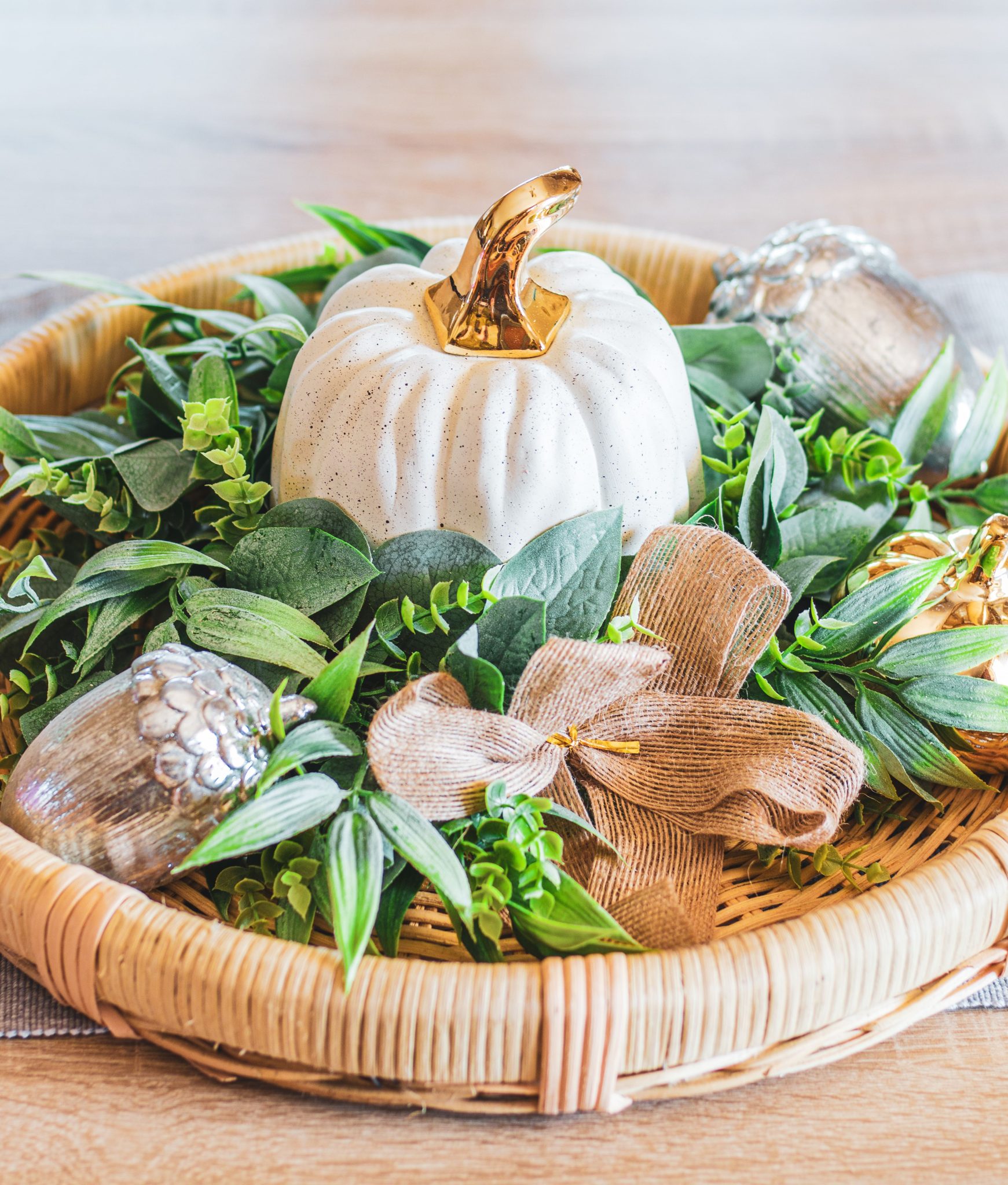 Autumn-themed tray featuring a decorative pumpkin, greenery, and metallic accents for a cozy seasonal touch.