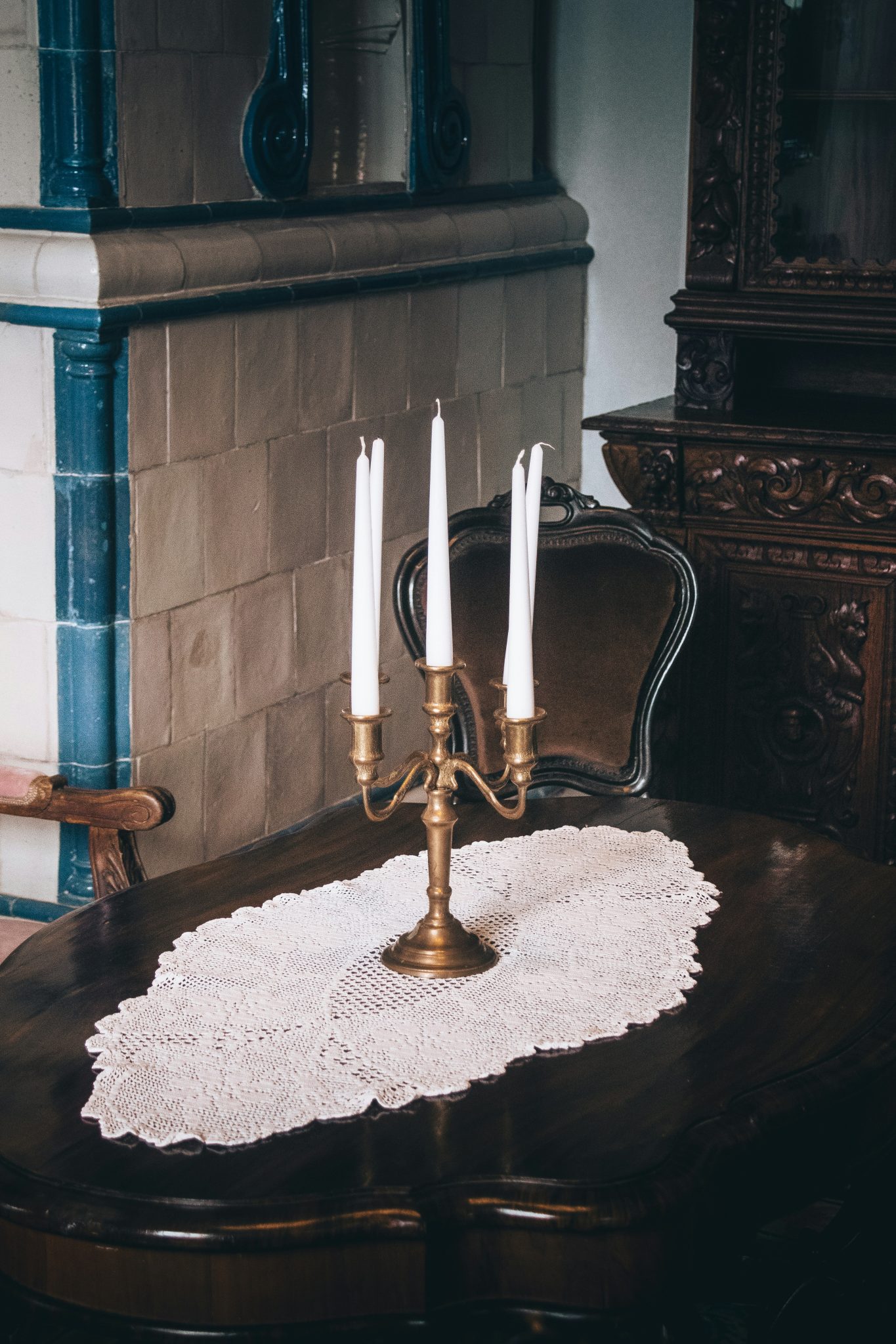 Candlestick with candles on a dark wooden table