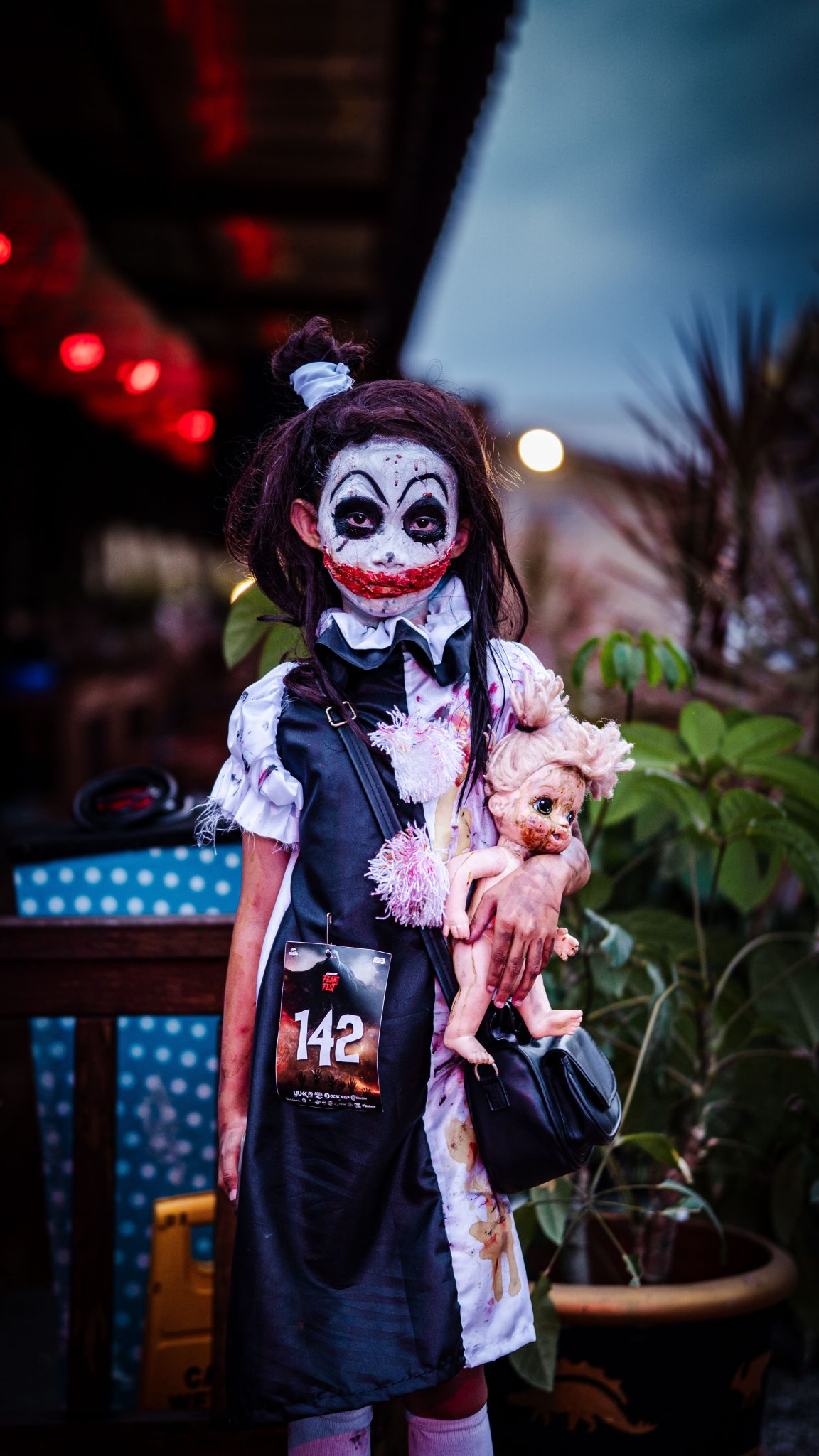 Creepy Halloween costume captured at night in Malang, Indonesia.