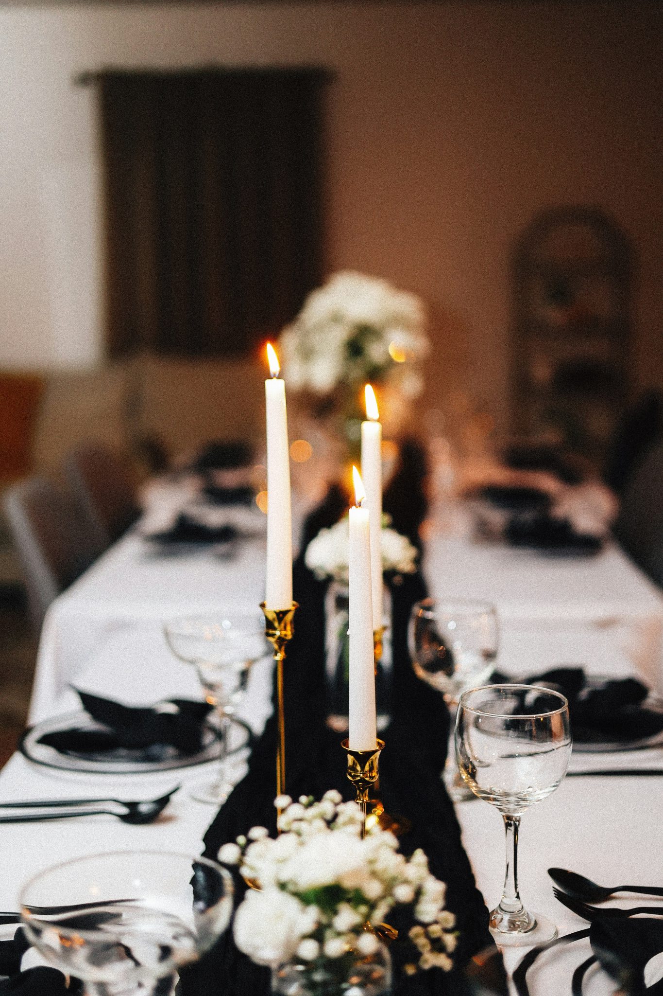 Elegant dinner table is set with candles