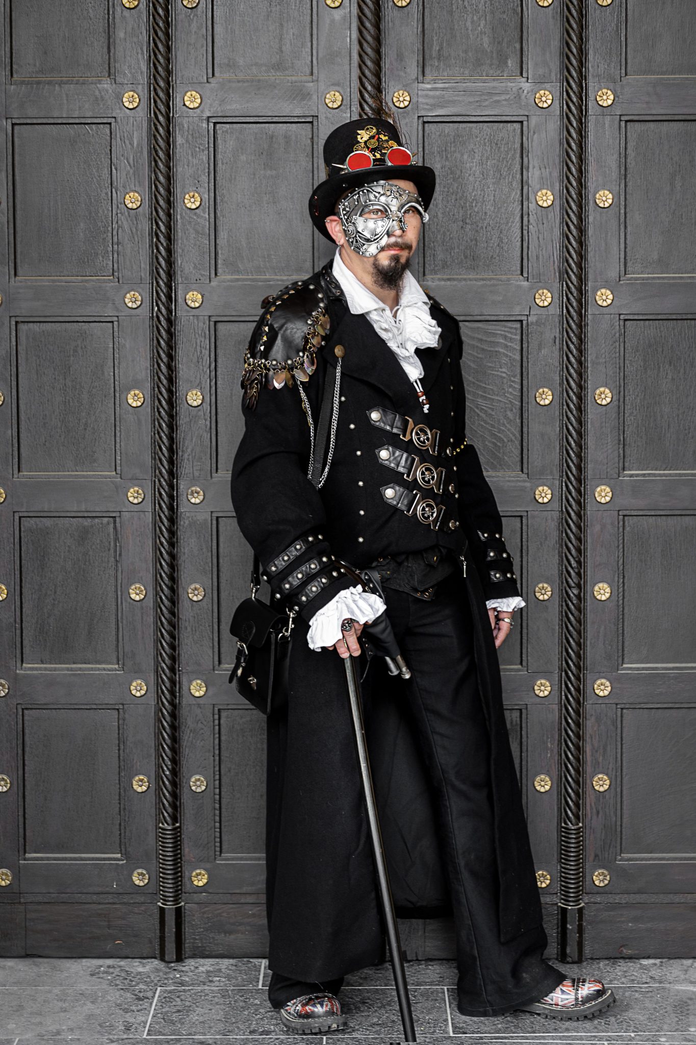 Elegant man in steampunk costume and mask at Leipzig carnival.