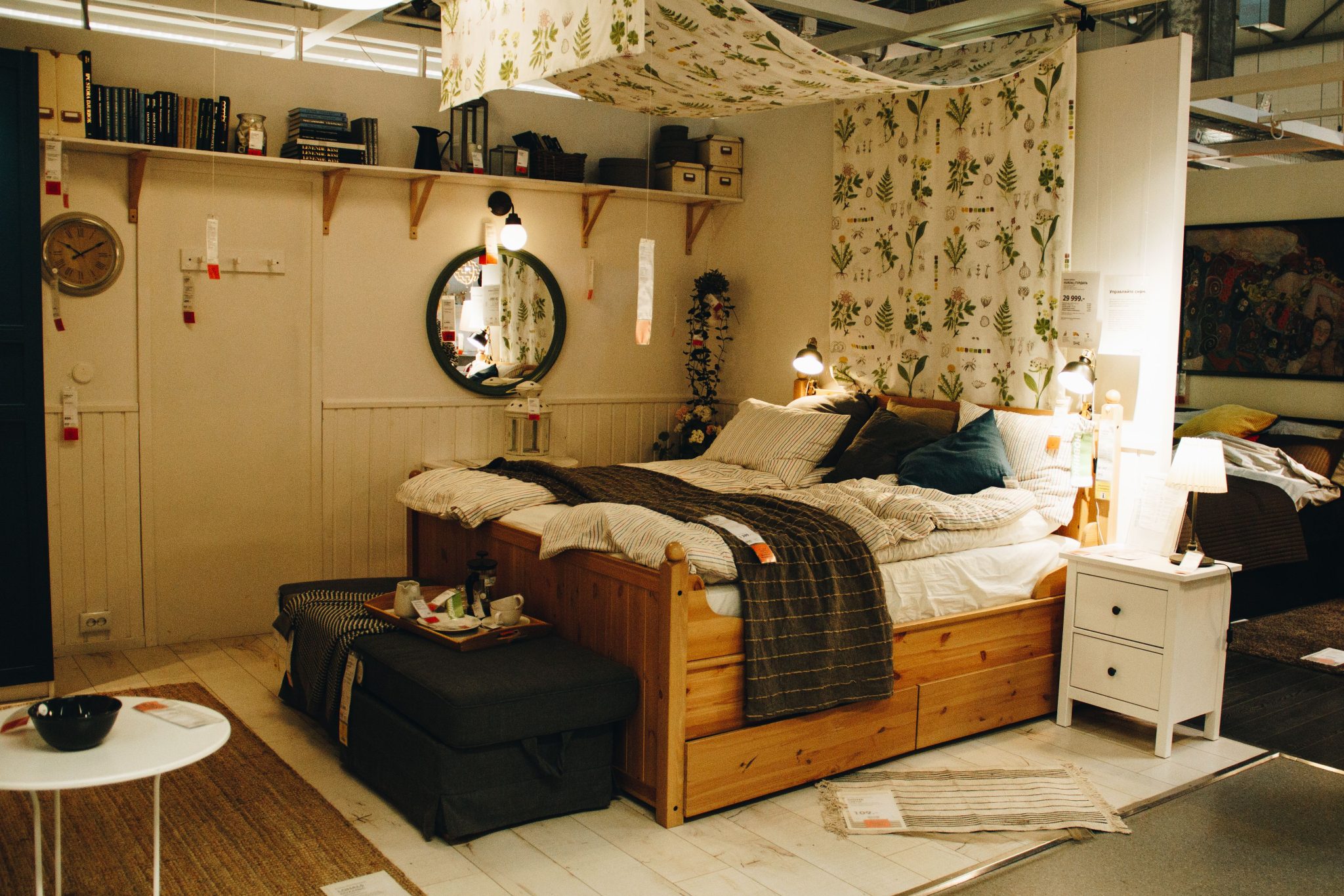 Explore a cozy and modern bedroom setup featuring wooden furniture, decorative rugs, and stylish lighting.