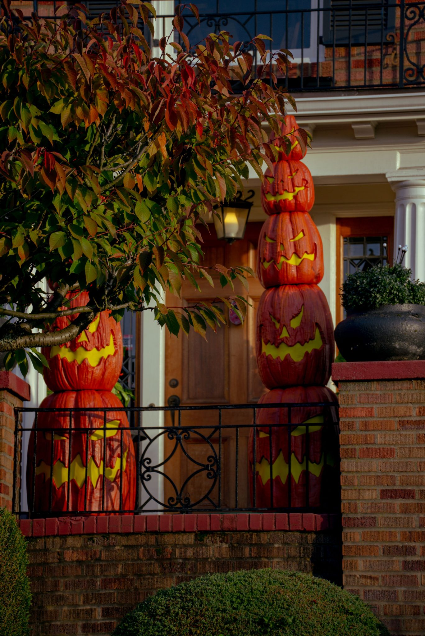 Festive Halloween decorations with carved pumpkins on a Seattle porch.