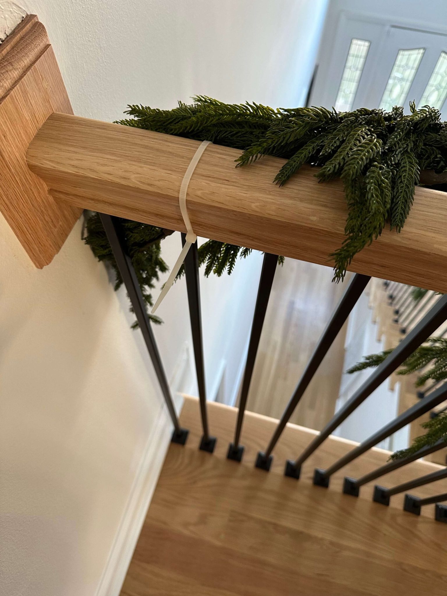 How To Hang Garland On A Staircase - allisonskiff.com