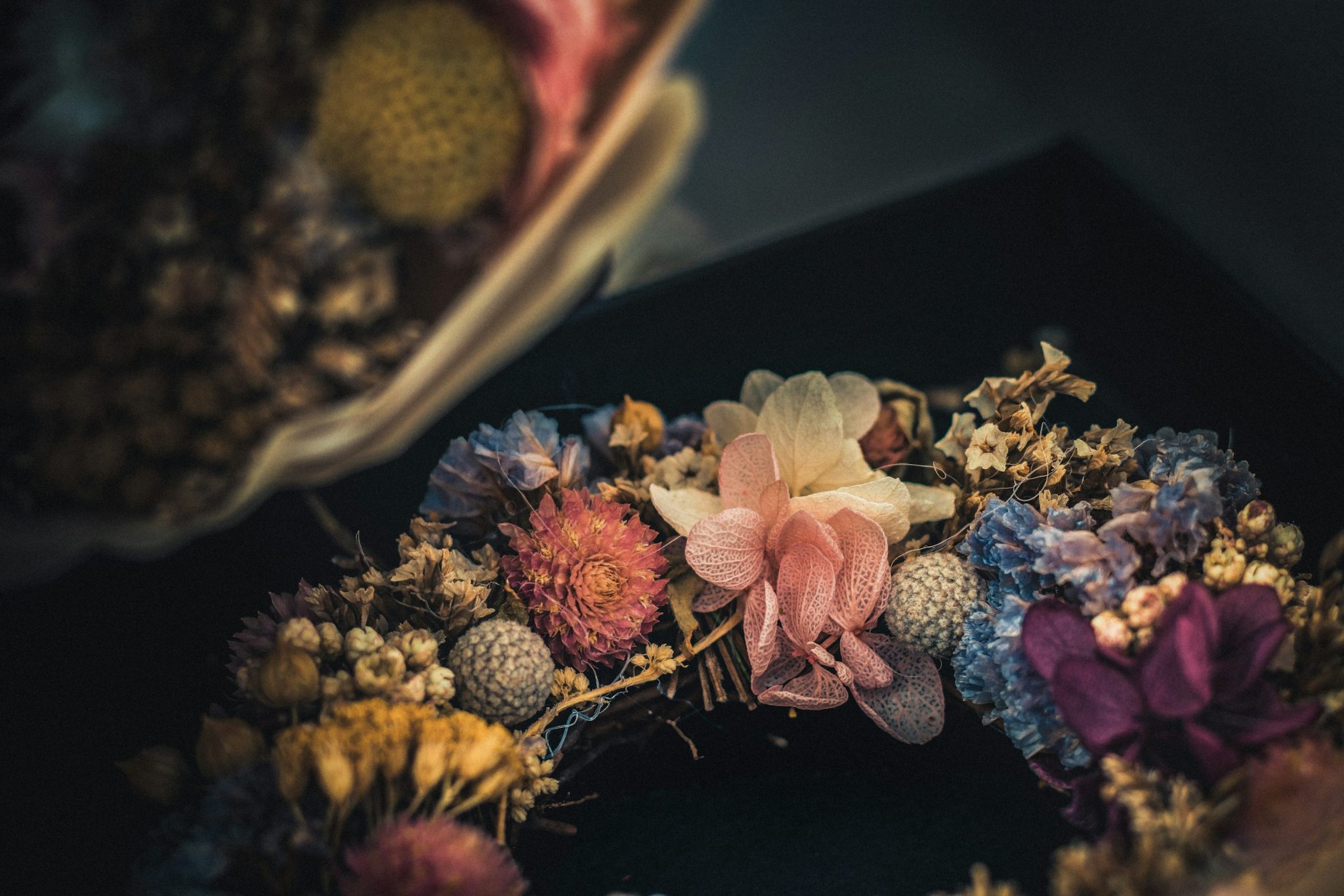 Photo of flower wreath on black surface - Free Photo on Unsplash
