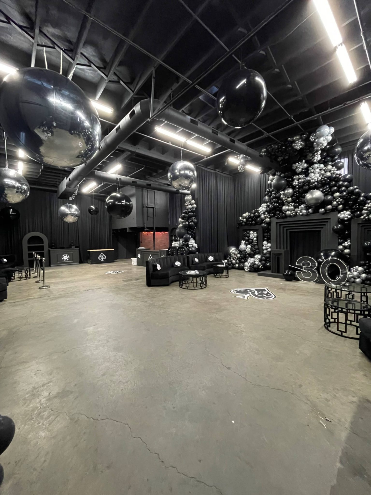 Warehouse with Black Walls,Tall Garage Doors And AC, Montebello, CA | Event | Peerspace