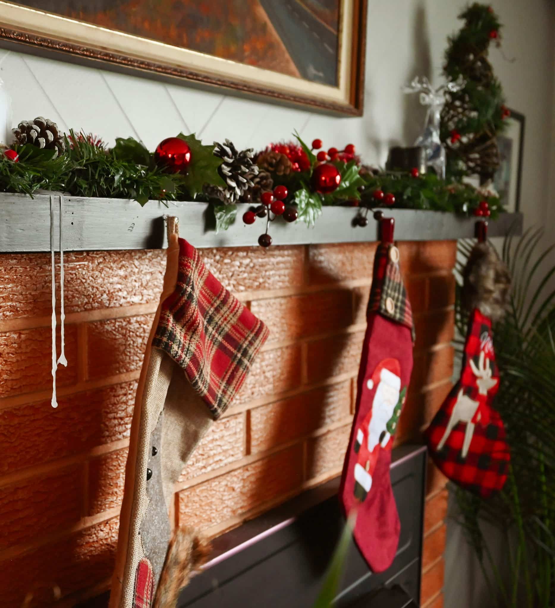A mantel with stockings and stockings hanging from it