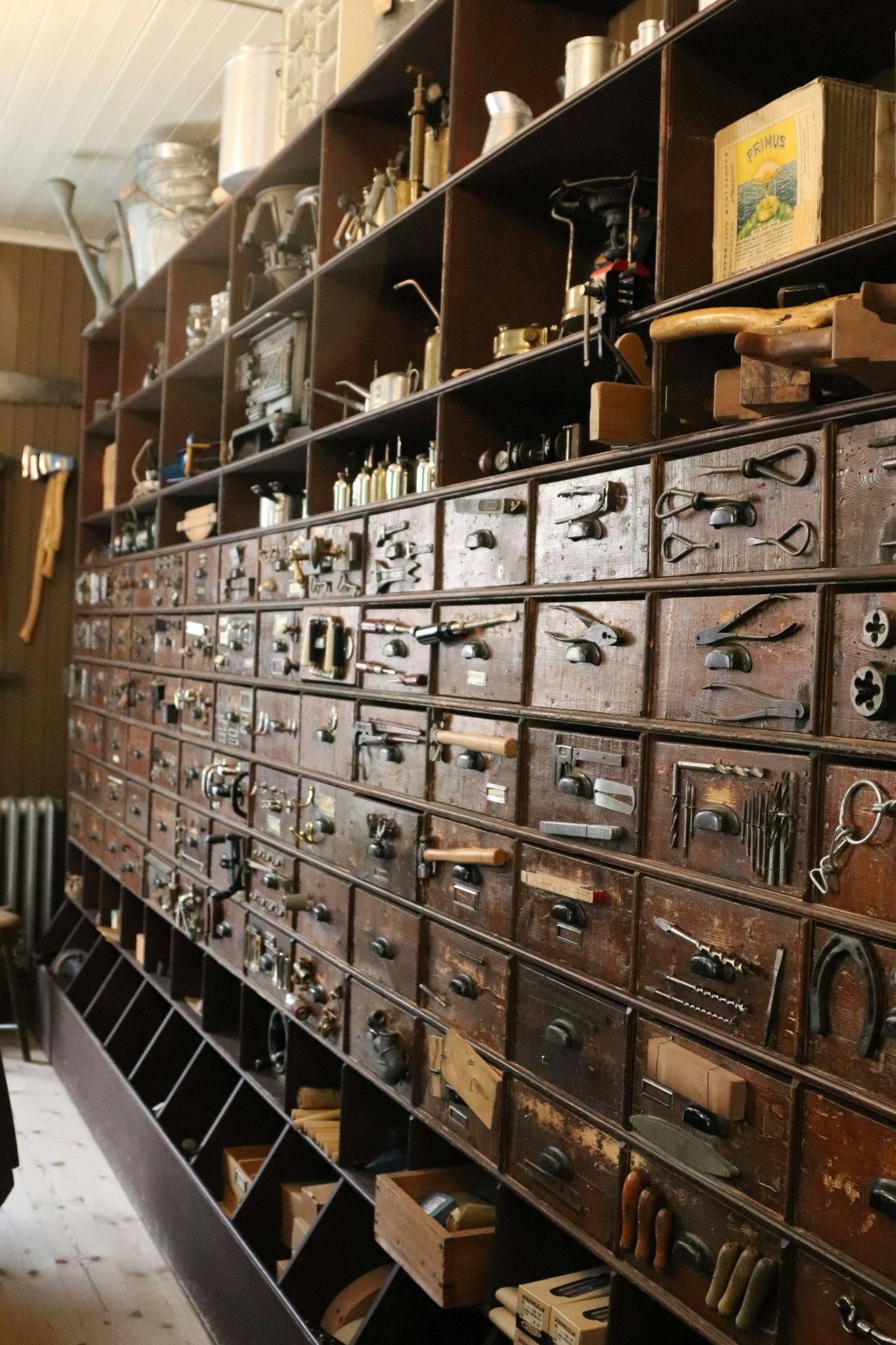 A wall of tools and drawers is shown