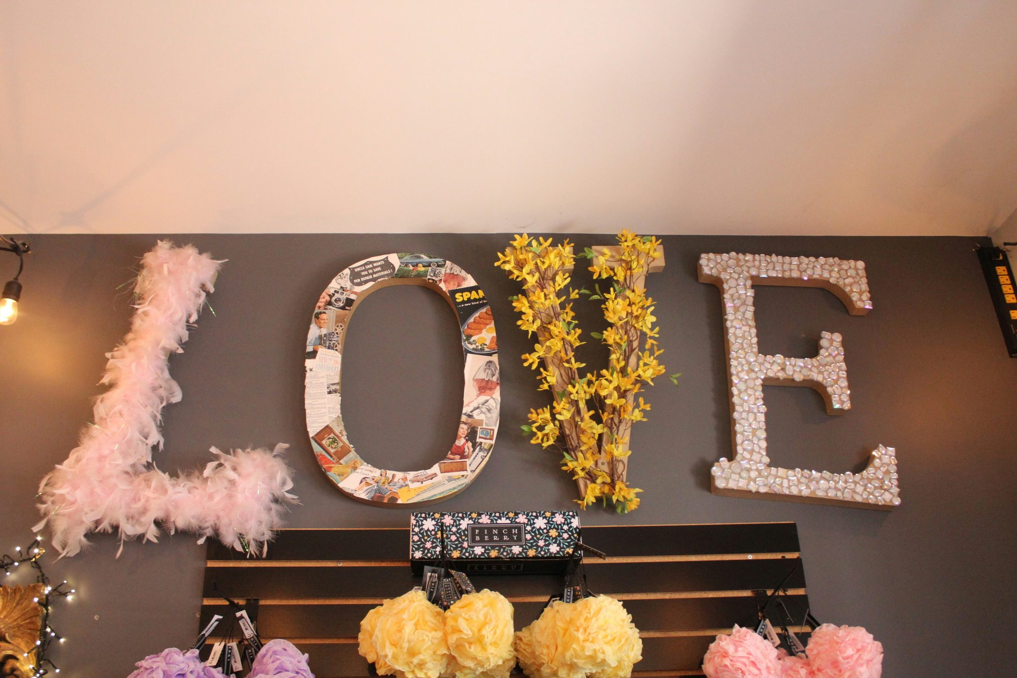 a wall with a sign that says love on it