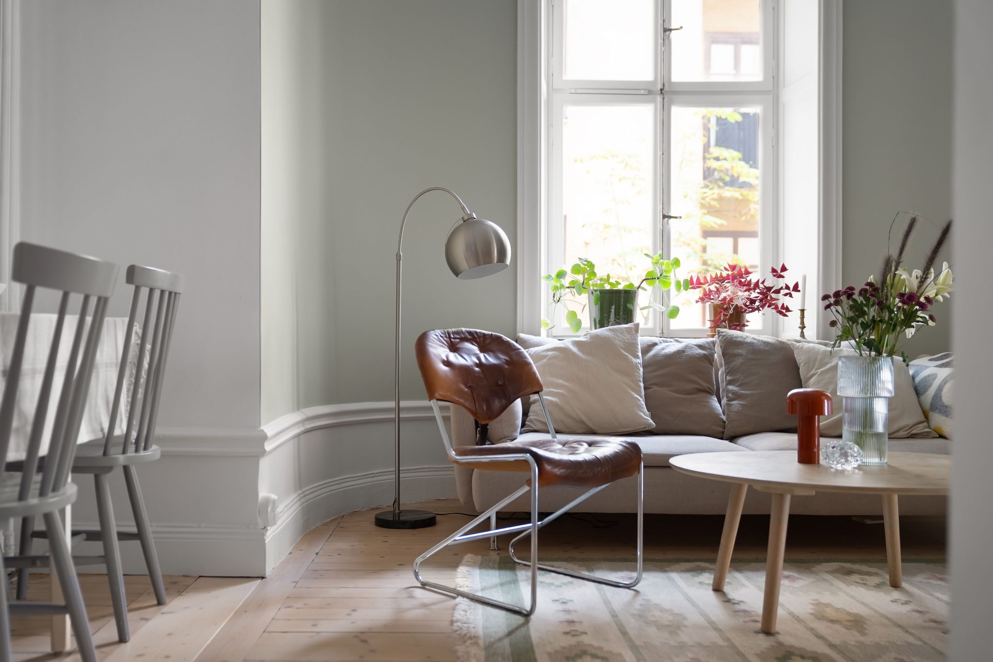 Bright Scandinavian living room with modern furniture and natural light.