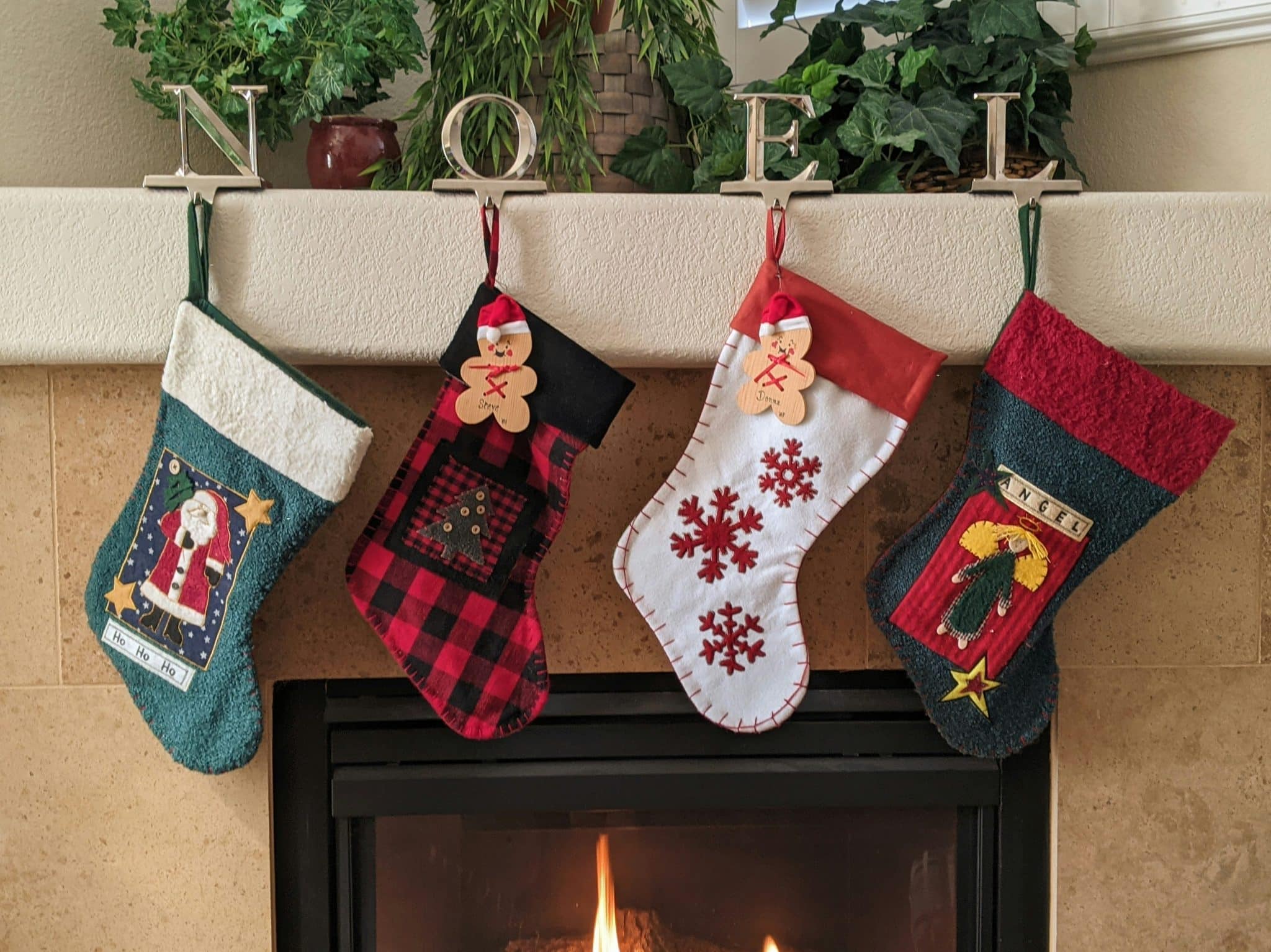 Christmas stockings hung over a fireplace
