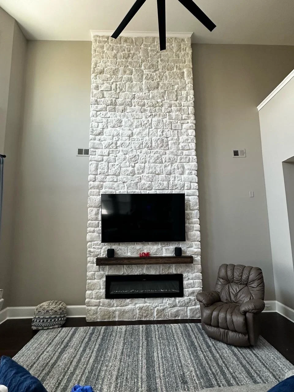 High Ceiling Stone Fireplace Media Wall Installation in Orlando | Florida Media Walls