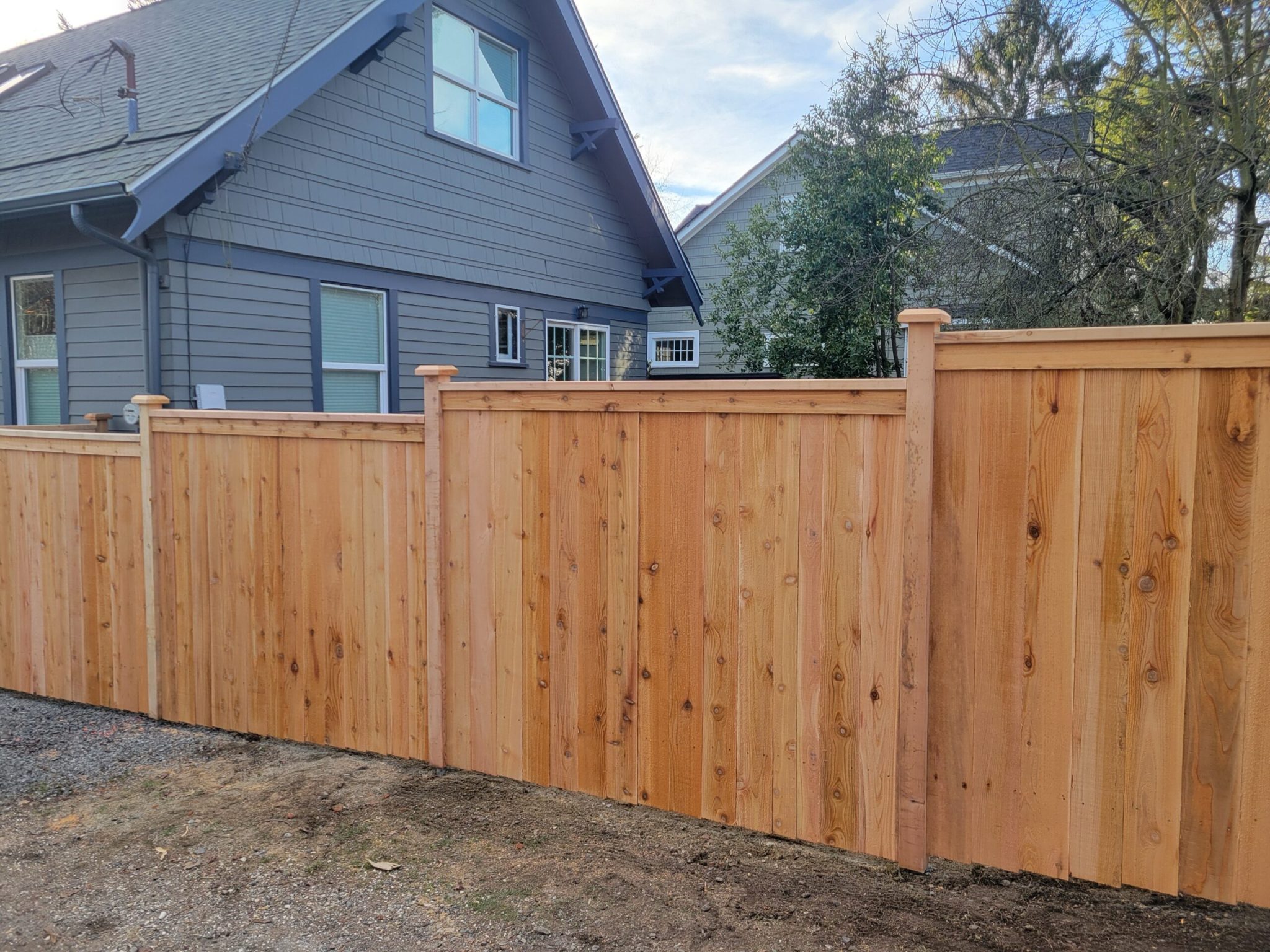 How to build a stepped and sloped fence - Rain City Fence