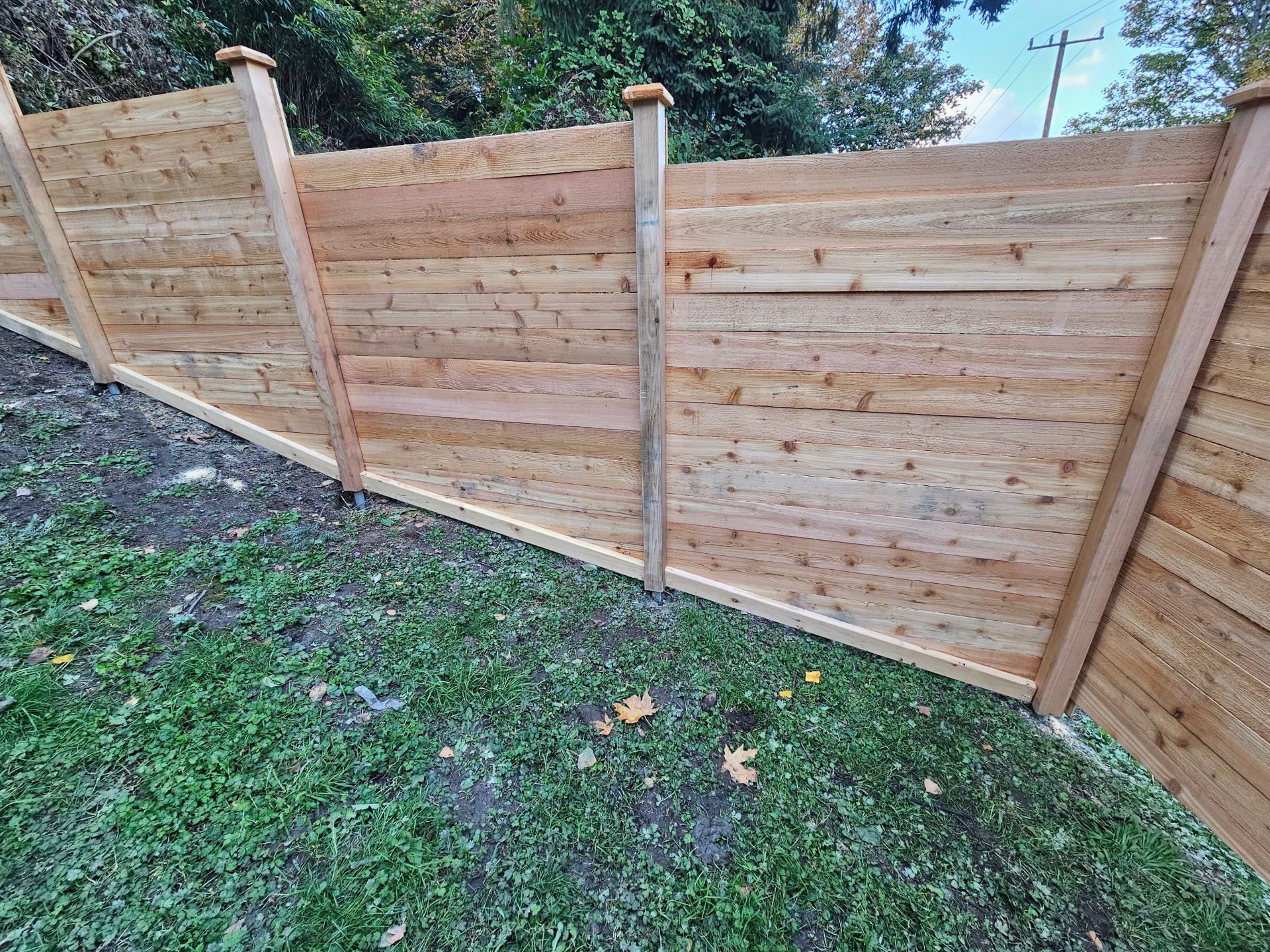 How to build a stepped and sloped fence - Rain City Fence