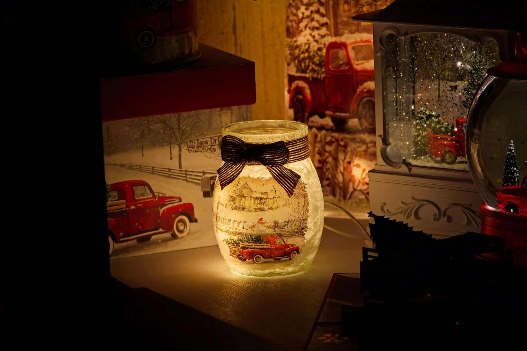 Illuminated jar with festive winter scene inside