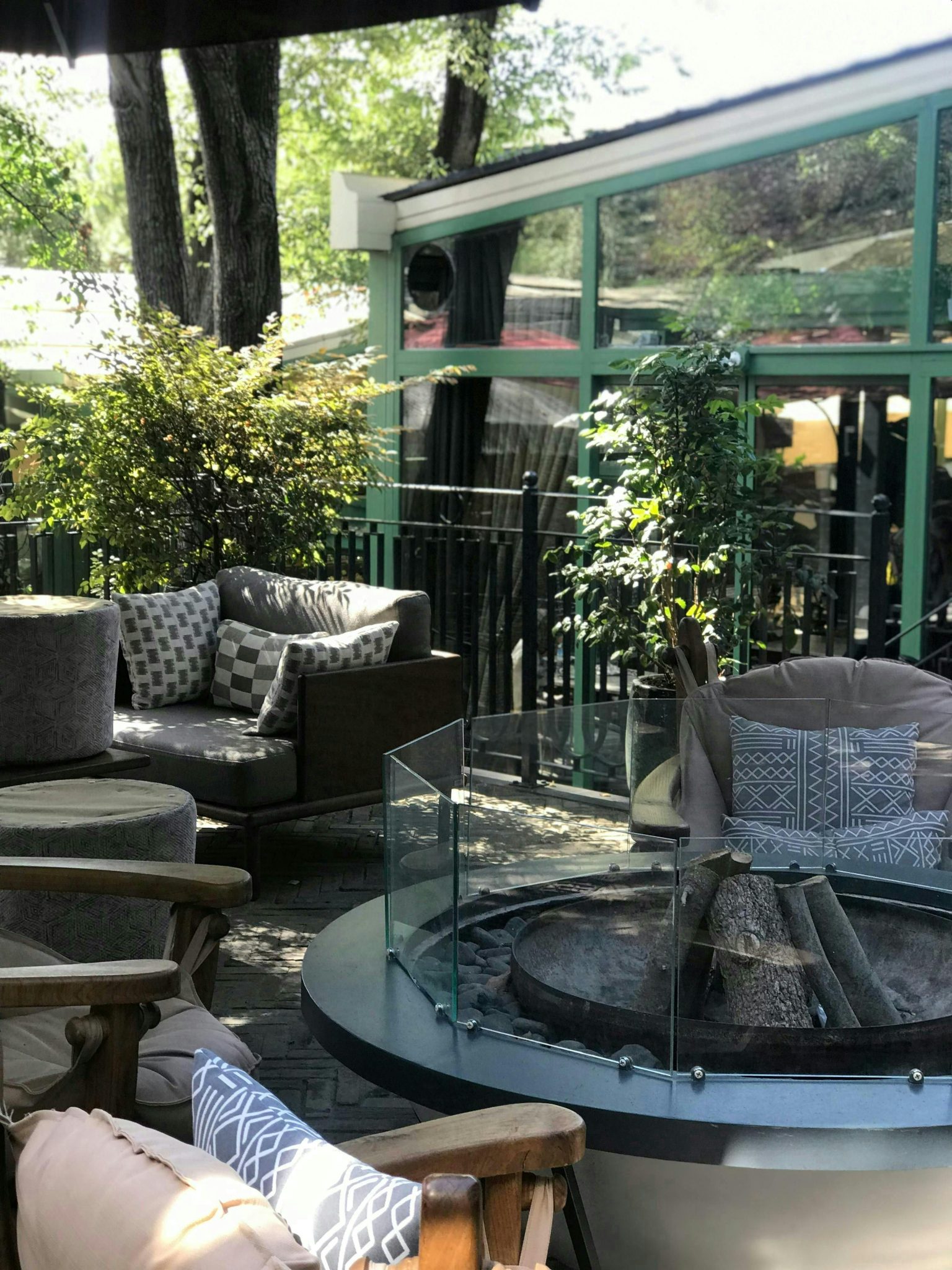 Inviting outdoor patio with cozy furniture and a stylish fire pit.