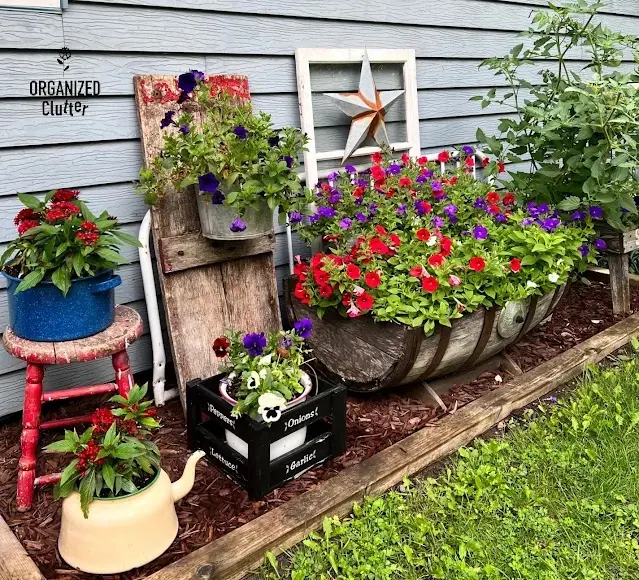 Junk Garden Whiskey Barrel Planter Ideas - Organized Clutter