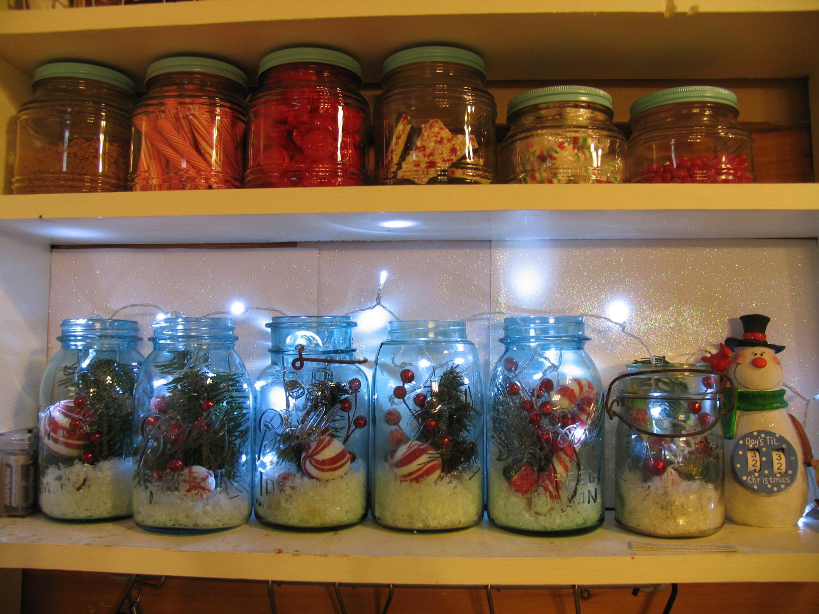 Mason jars filled with Christmas picks,snow, and lights for holiday cheer!