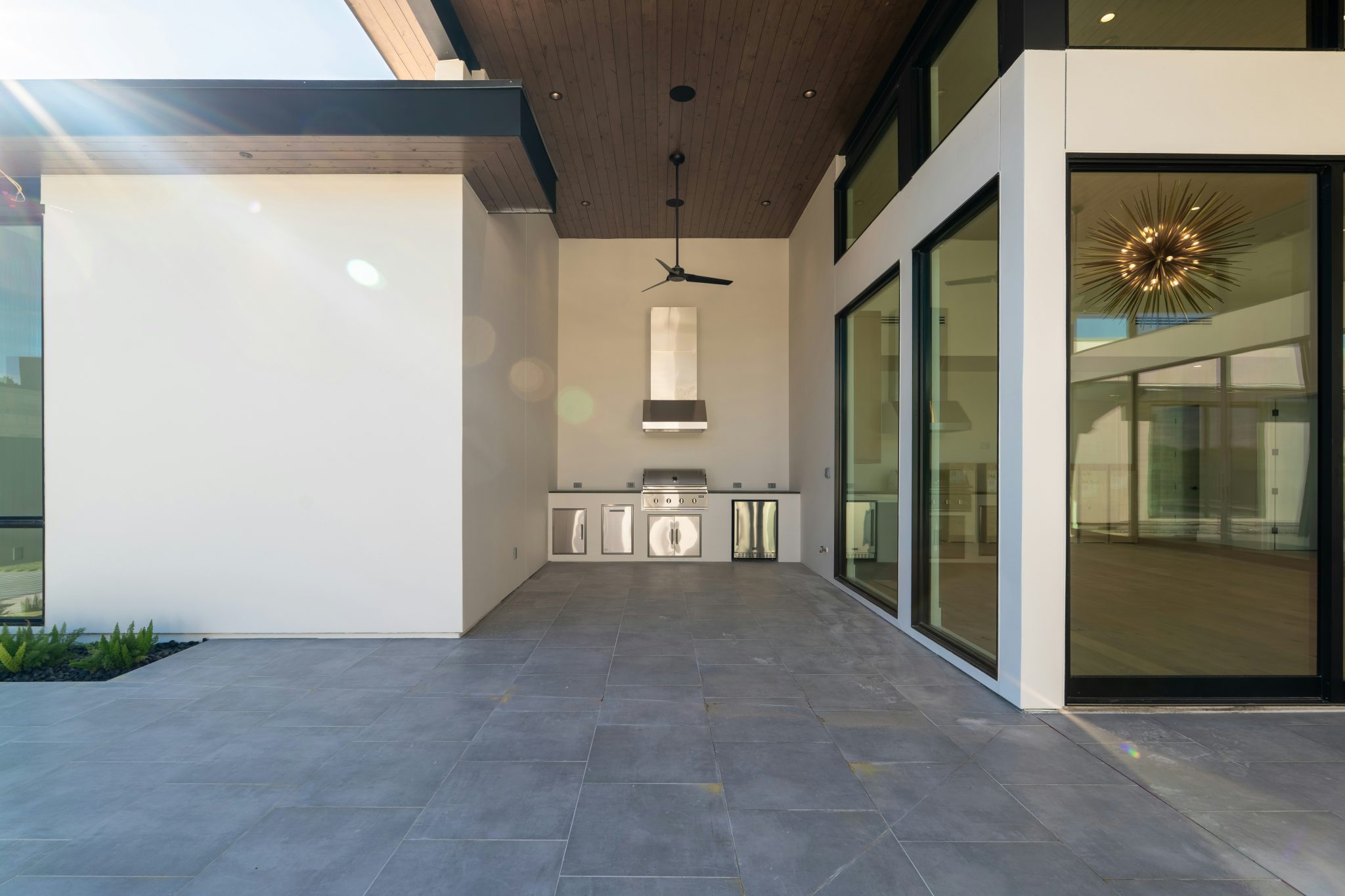 Sleek modern outdoor patio with a built-in kitchen