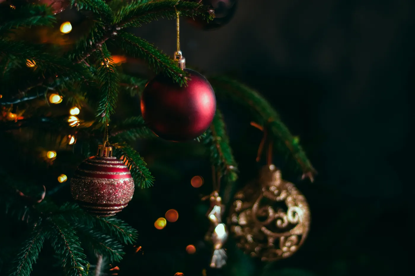 a christmas tree with ornaments hanging from it