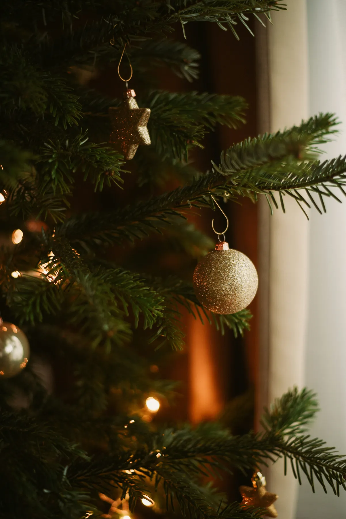a christmas tree with ornaments hanging from it