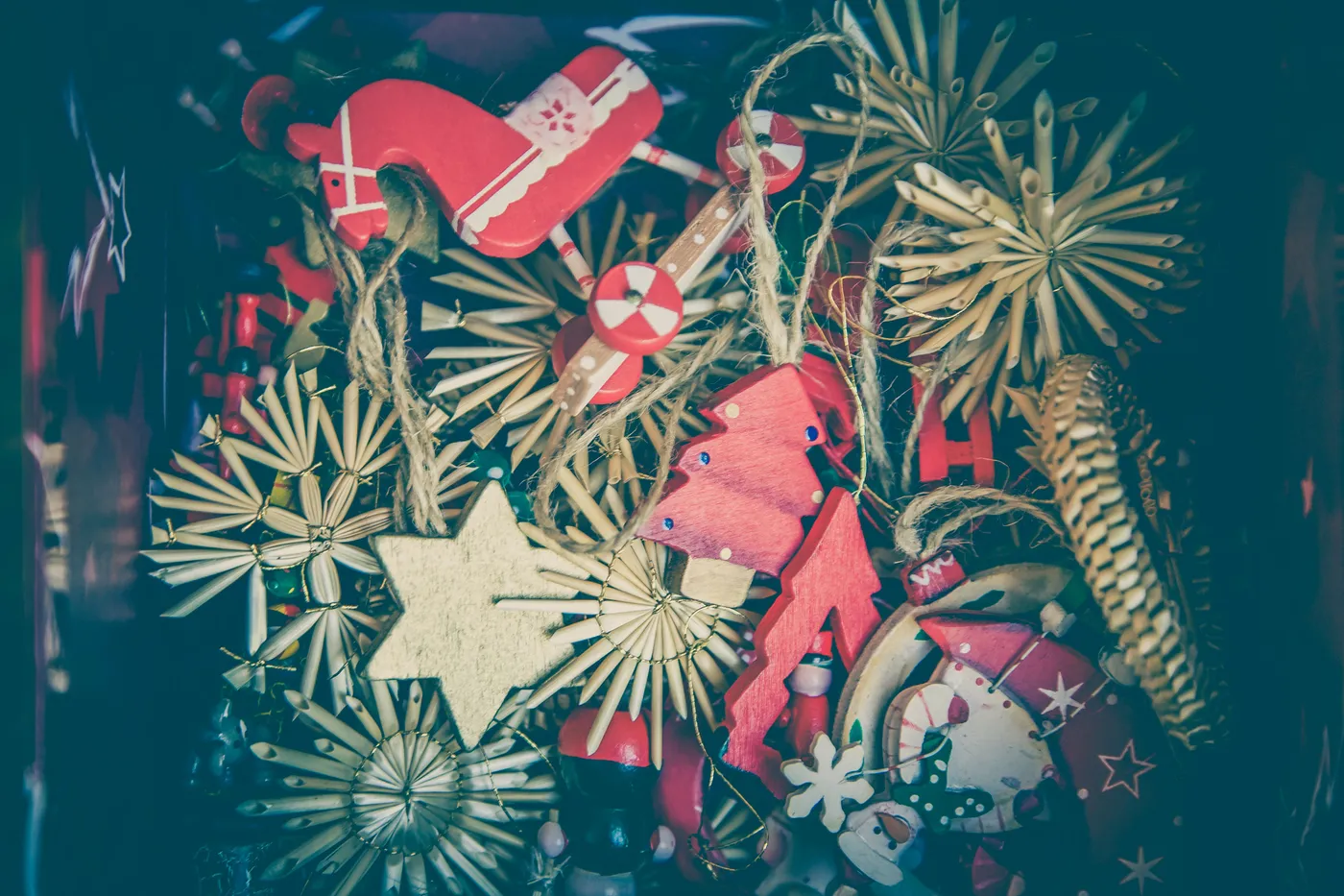 A collection of colorful Christmas ornaments showcasing rustic designs and vibrant hues.