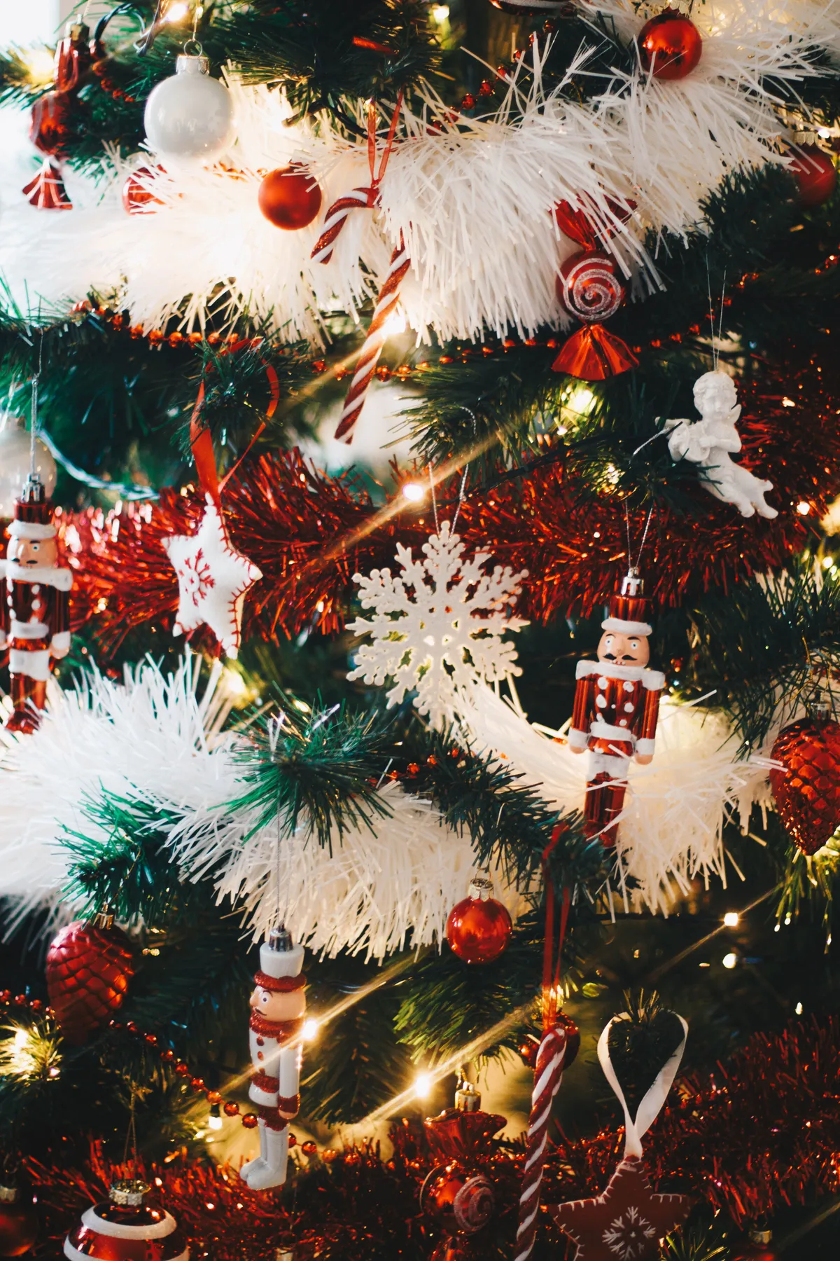A festive Christmas tree adorned with colorful ornaments and sparkling lights.