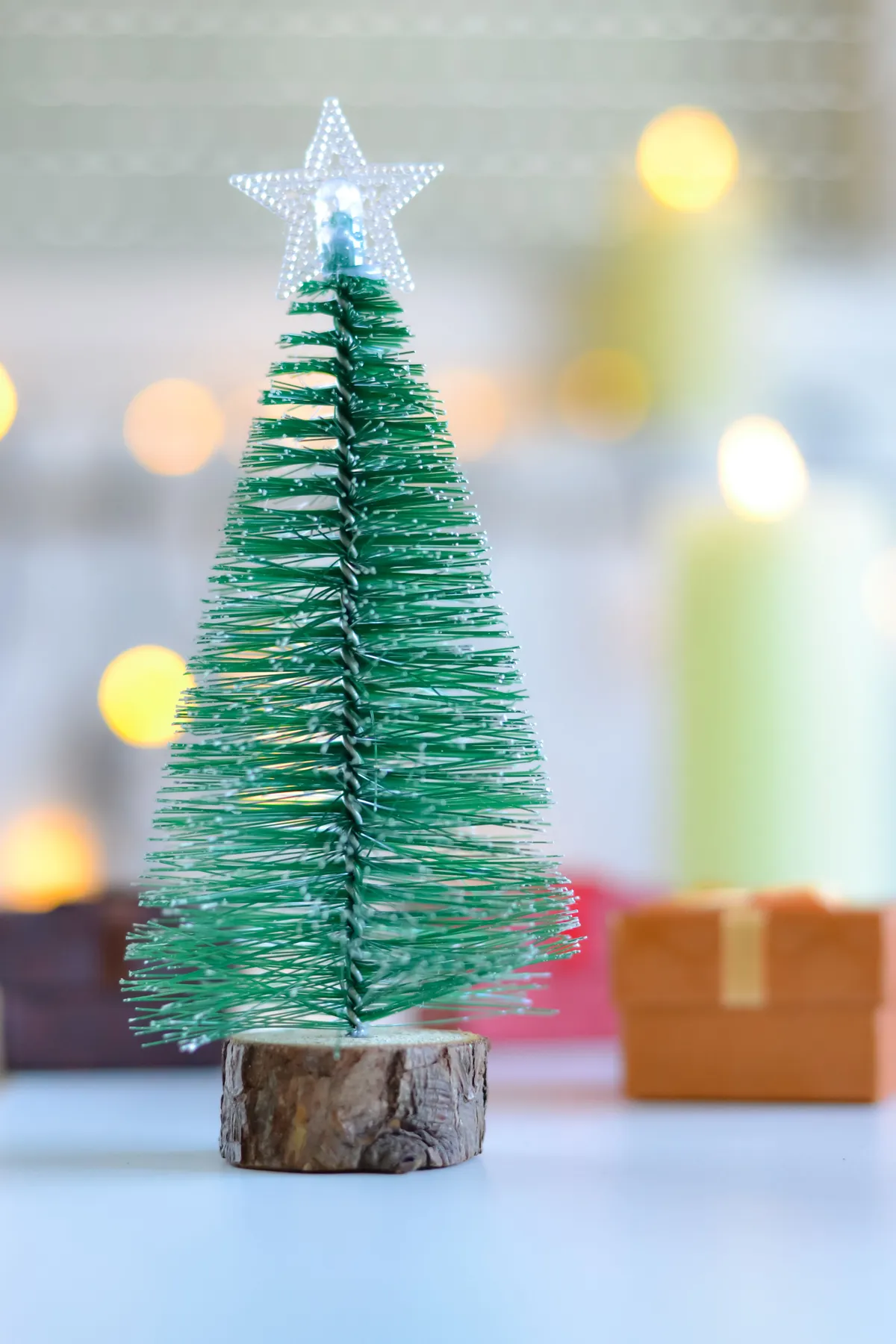 A festive miniature Christmas tree with a star topper, perfect for holiday decoration.