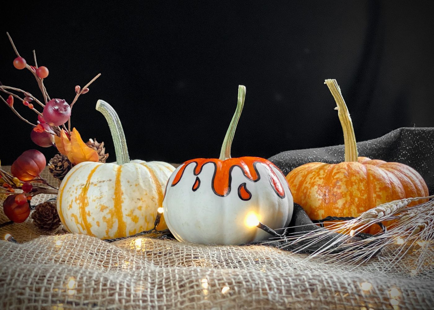 a group of pumpkins sitting on top of a table