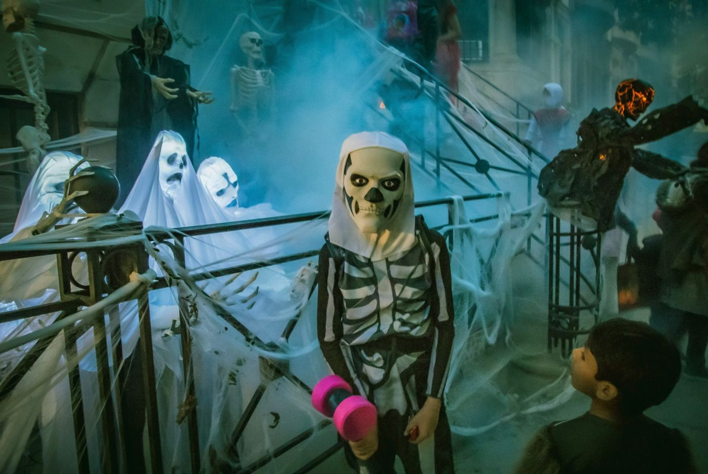 A scary looking kid dresses up as a skeleton for Halloween in New York.