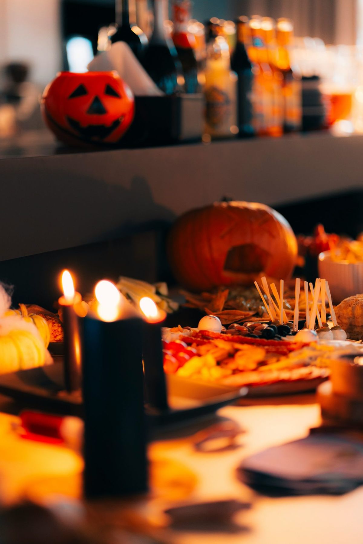 A table topped with lots of food and candles