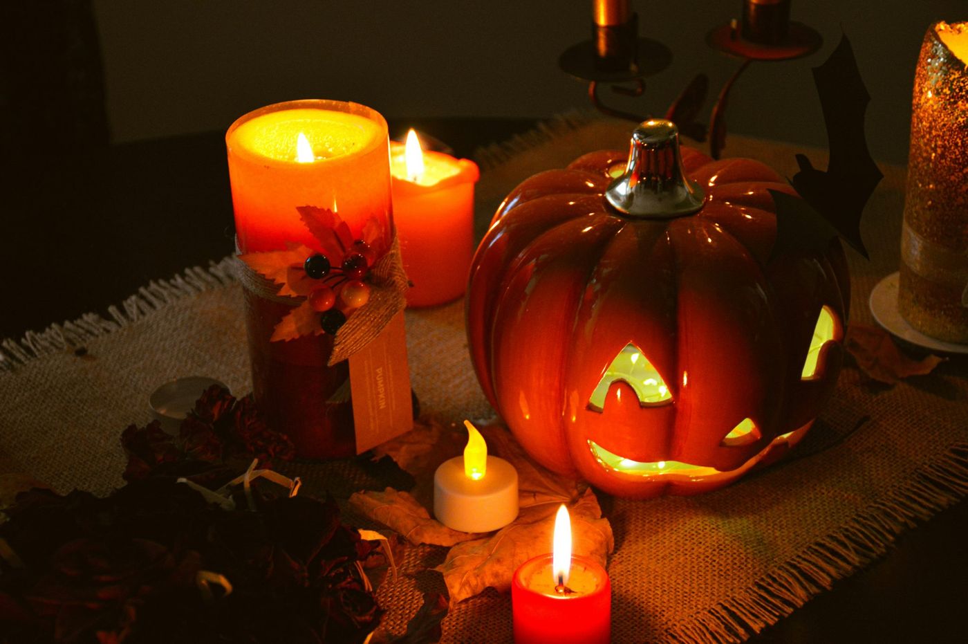 a table topped with lots of lit candles