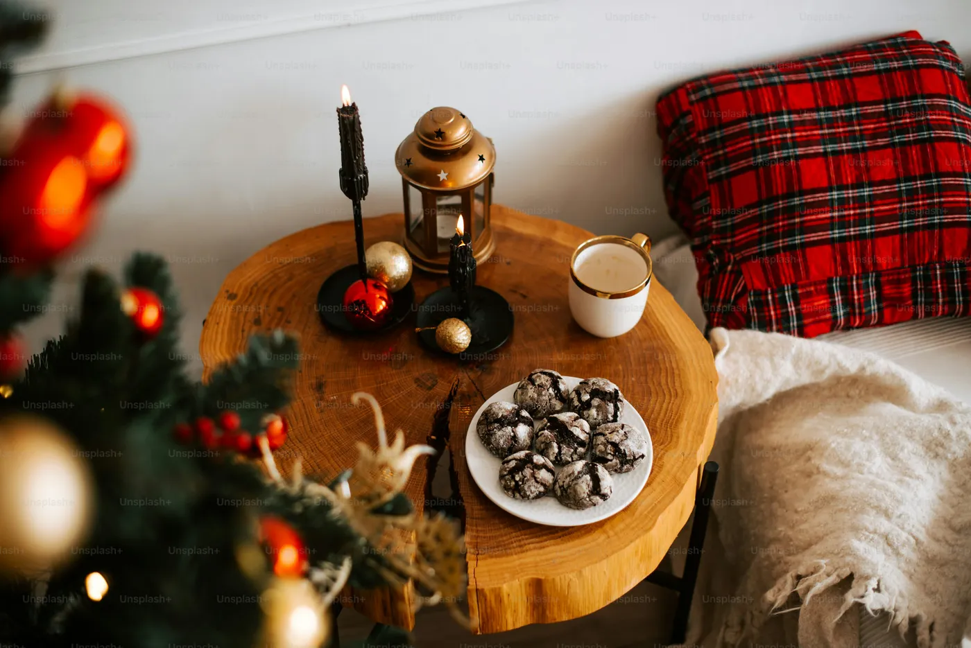 A table with a plate of cookies and a cup of coffee - Photo on Unsplash+