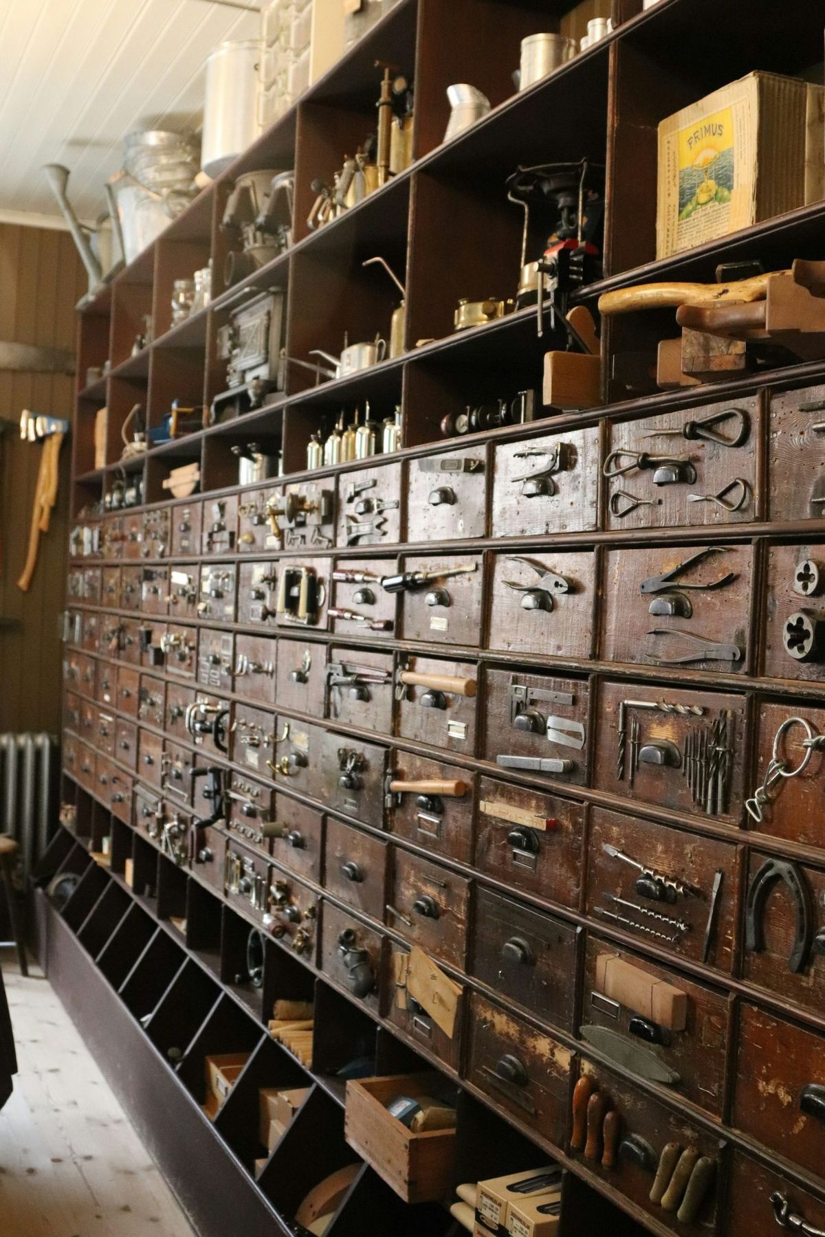 A wall of tools and drawers is shown