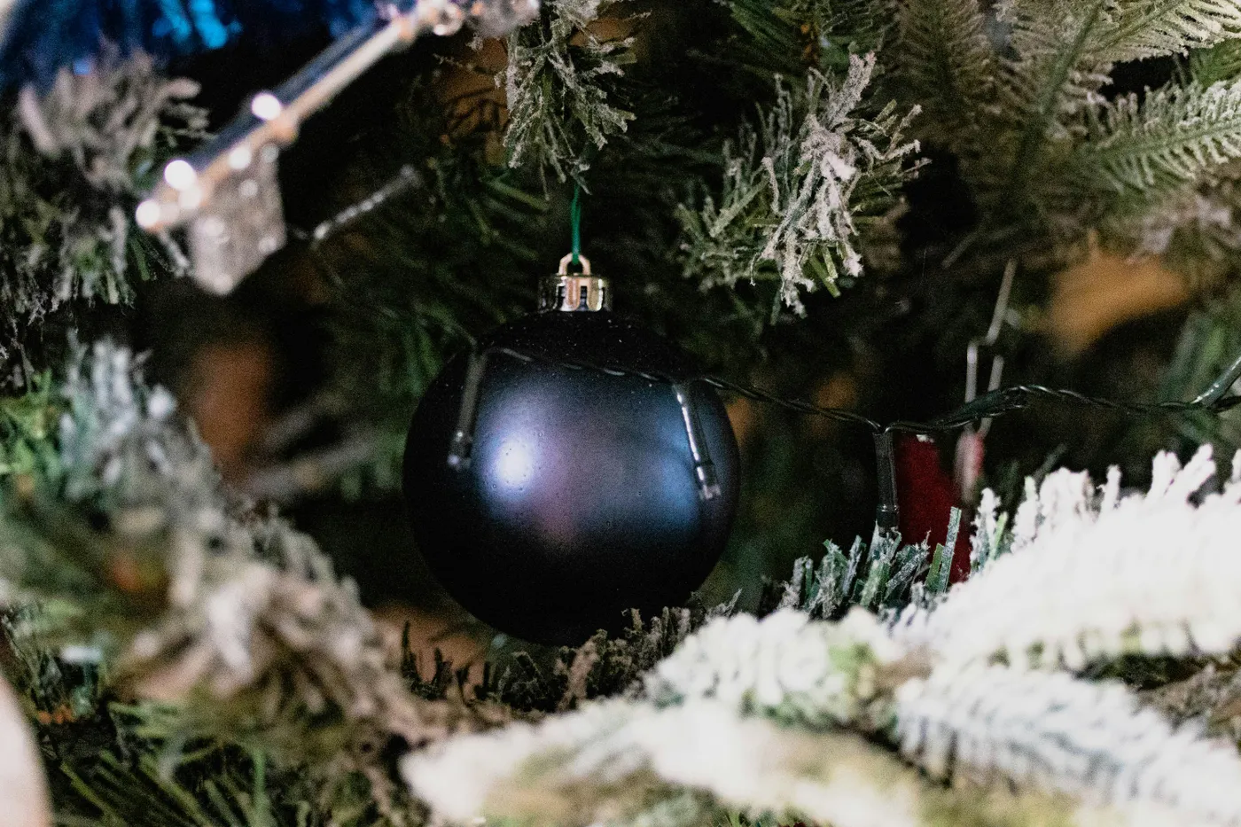 Blue decorative ball hanging on the Christmas tree.