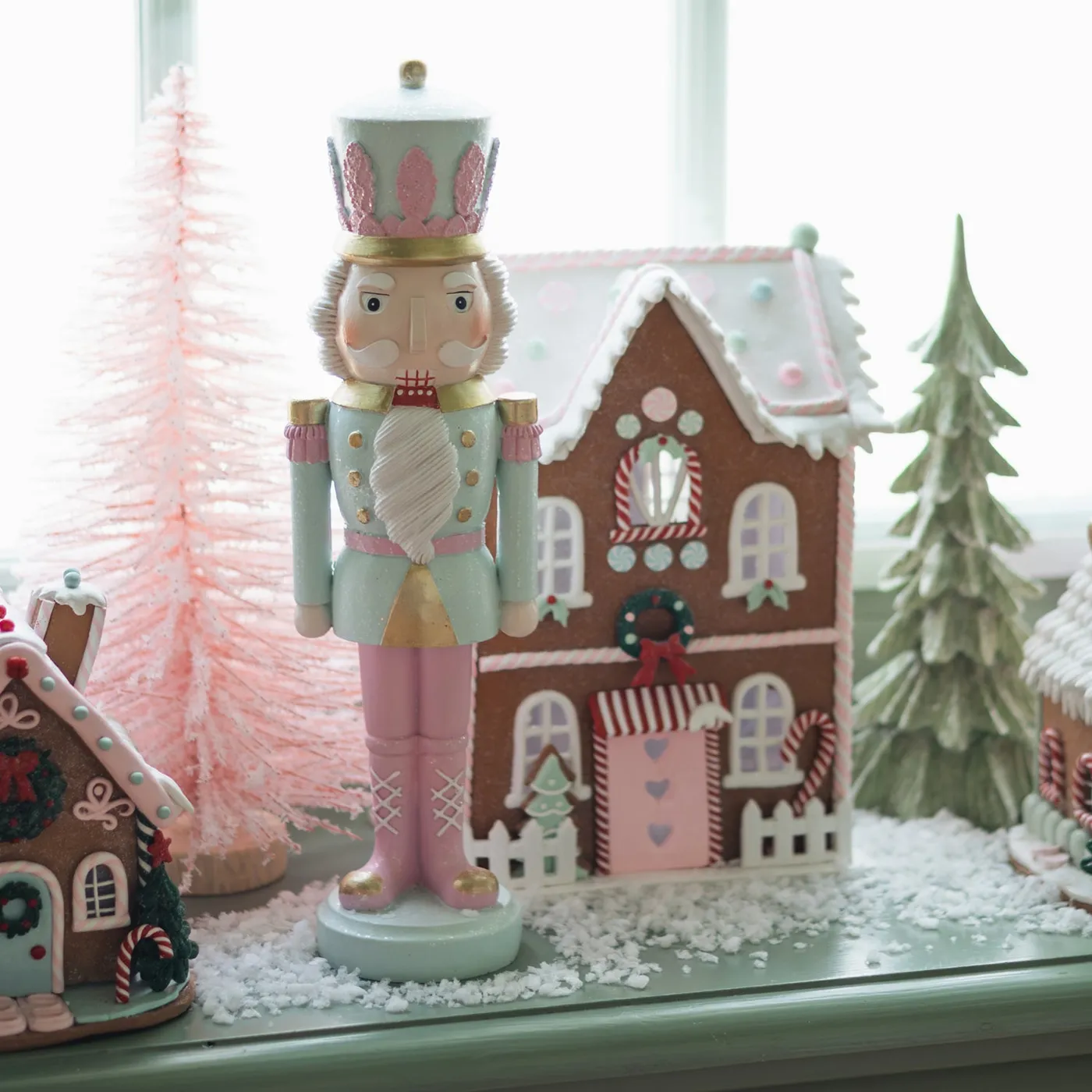 Cheerful windowsill with Nutcrackers and gingerbread houses
