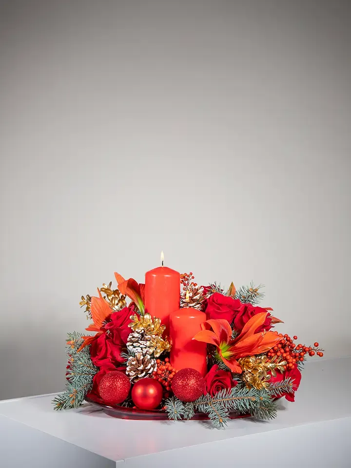 Christmas centerpiece with candles and flowers