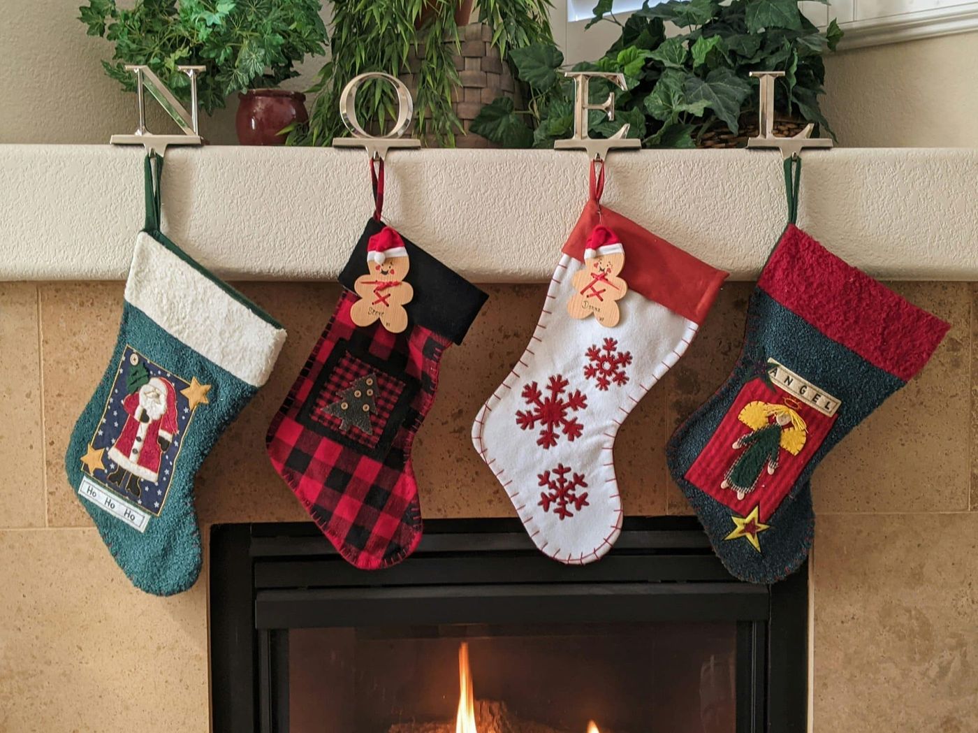 Christmas stockings hung over a fireplace
