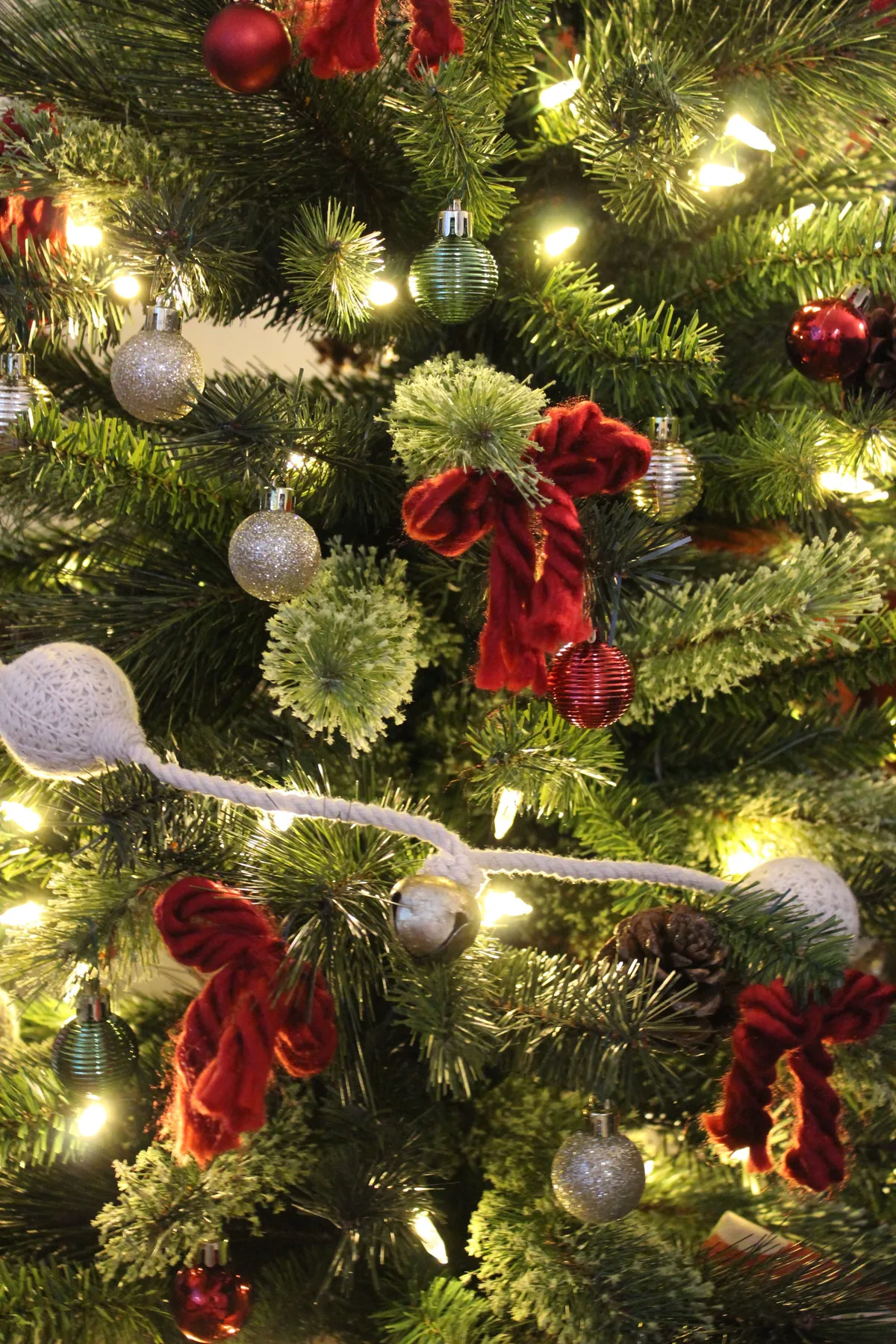 Close-up of a decorated Christmas tree with colorful ornaments and lights.